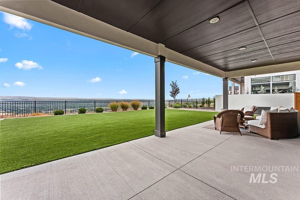 Fenced backyard with a patio and an outdoor hangout area