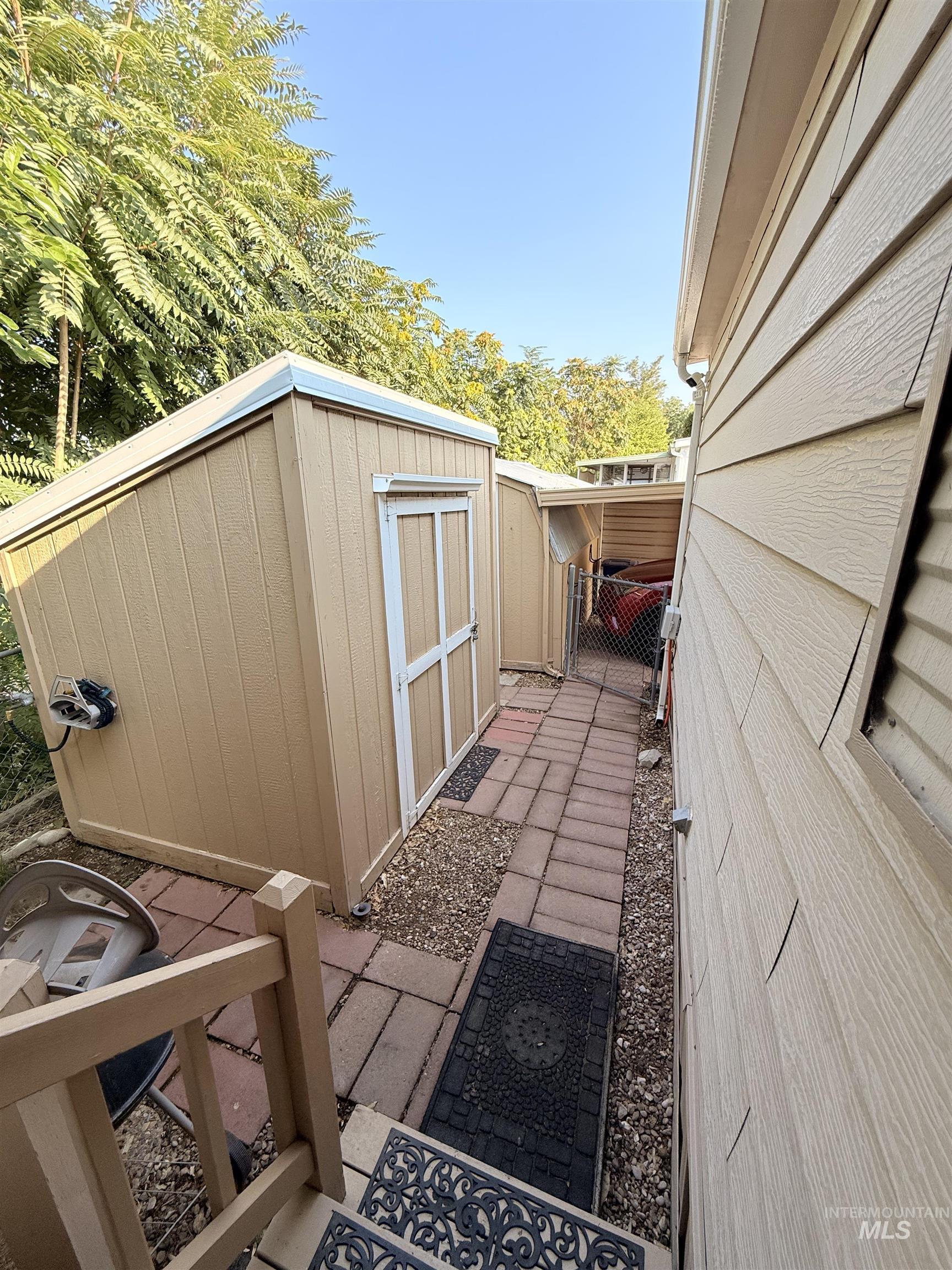 Exterior space featuring a shed