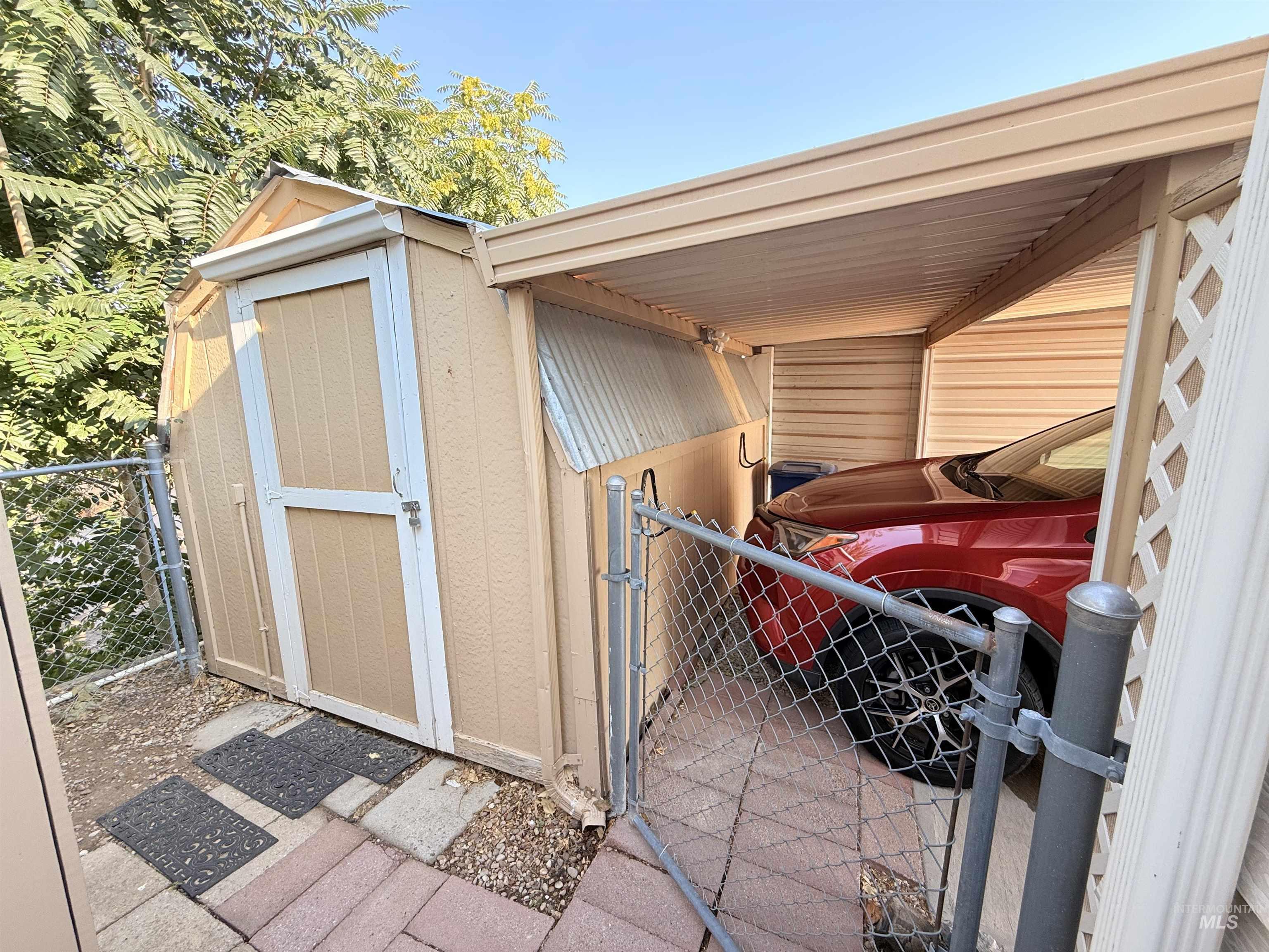 View of shed featuring a gate