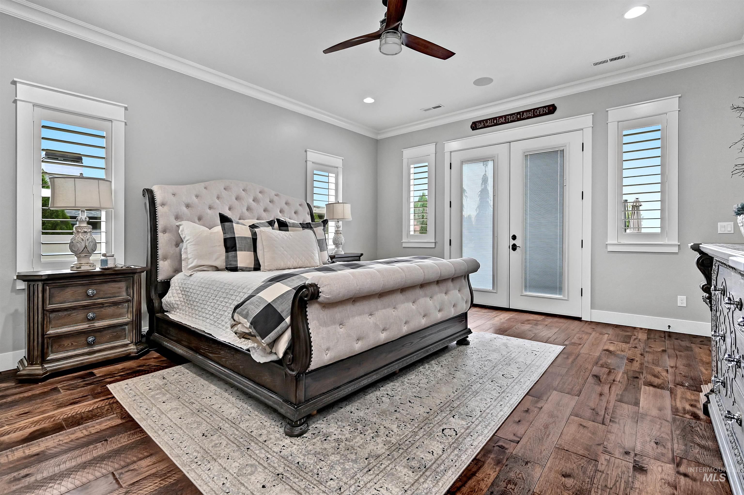 Bedroom featuring french doors, crown molding, access to outside, ceiling fan, and dark wood-style floors