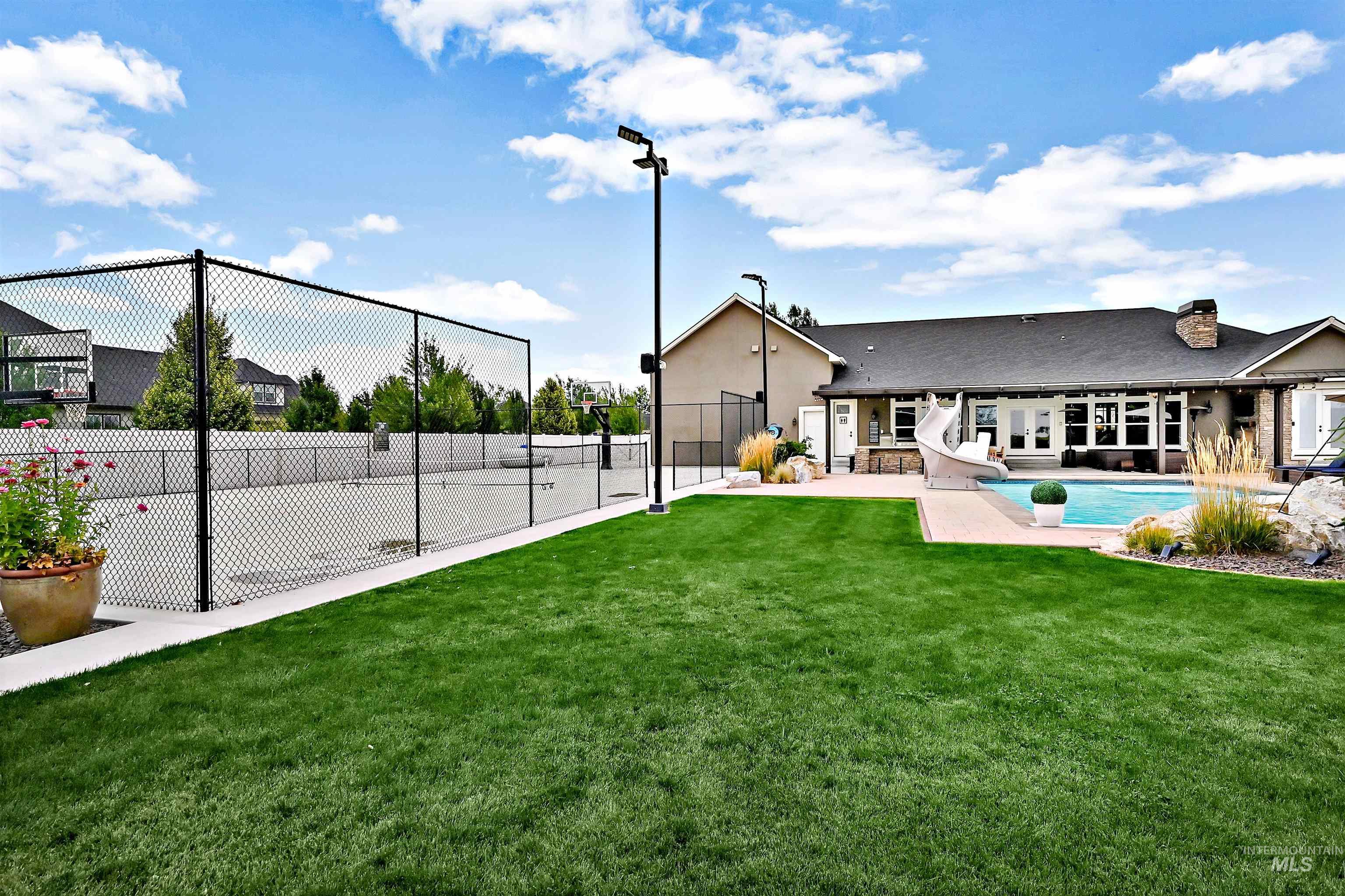 Rear view of property with a patio area and a chimney