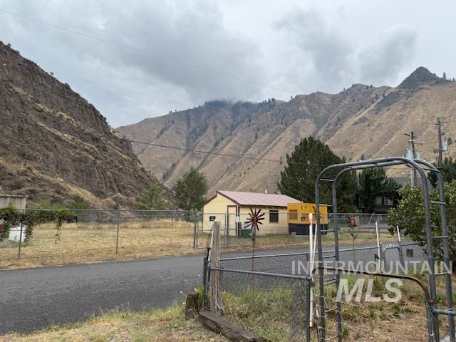 View of mountain backdrop with rural landscape