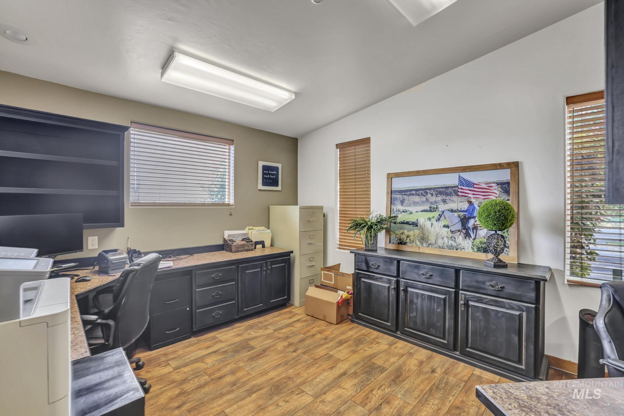 Office area featuring light wood-style floors