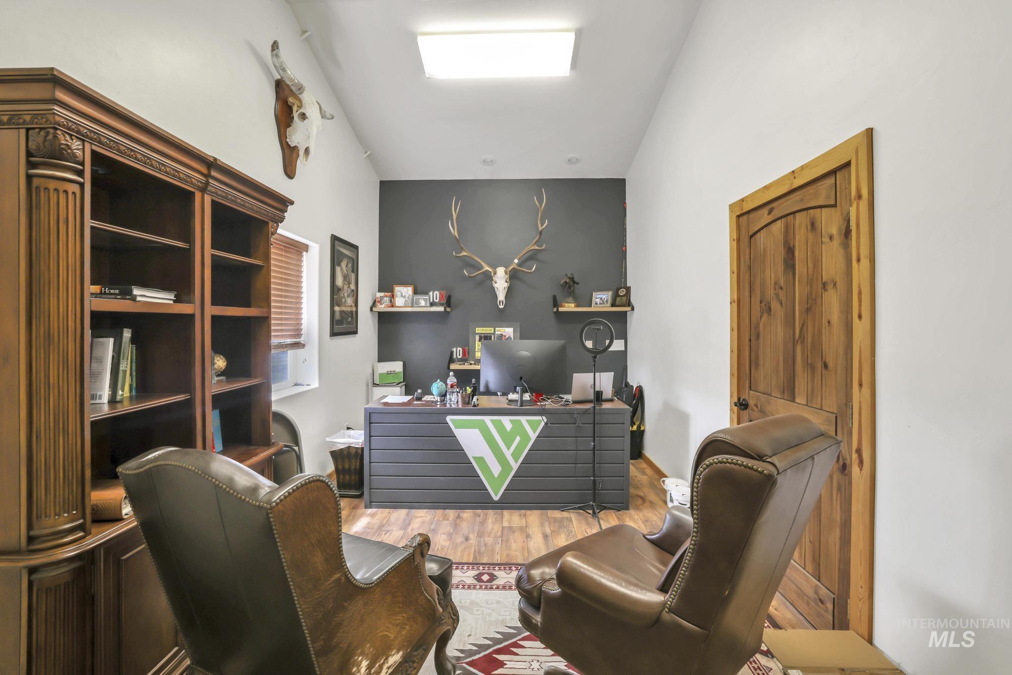 Home office with wood finished floors