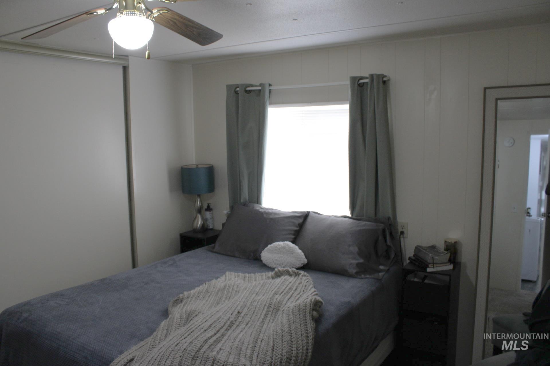 Bedroom with a closet and a ceiling fan