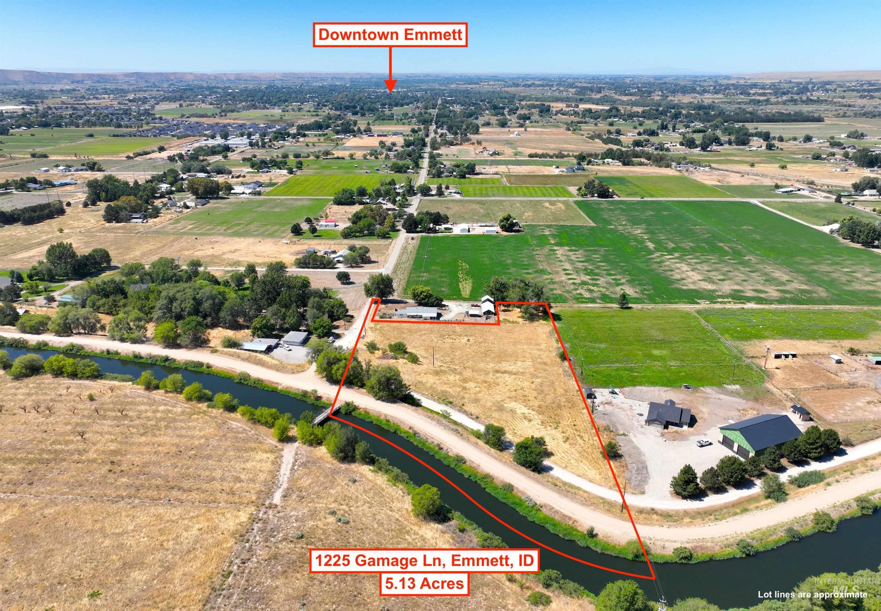 View of rural area featuring property parcel outlined and rows of crops