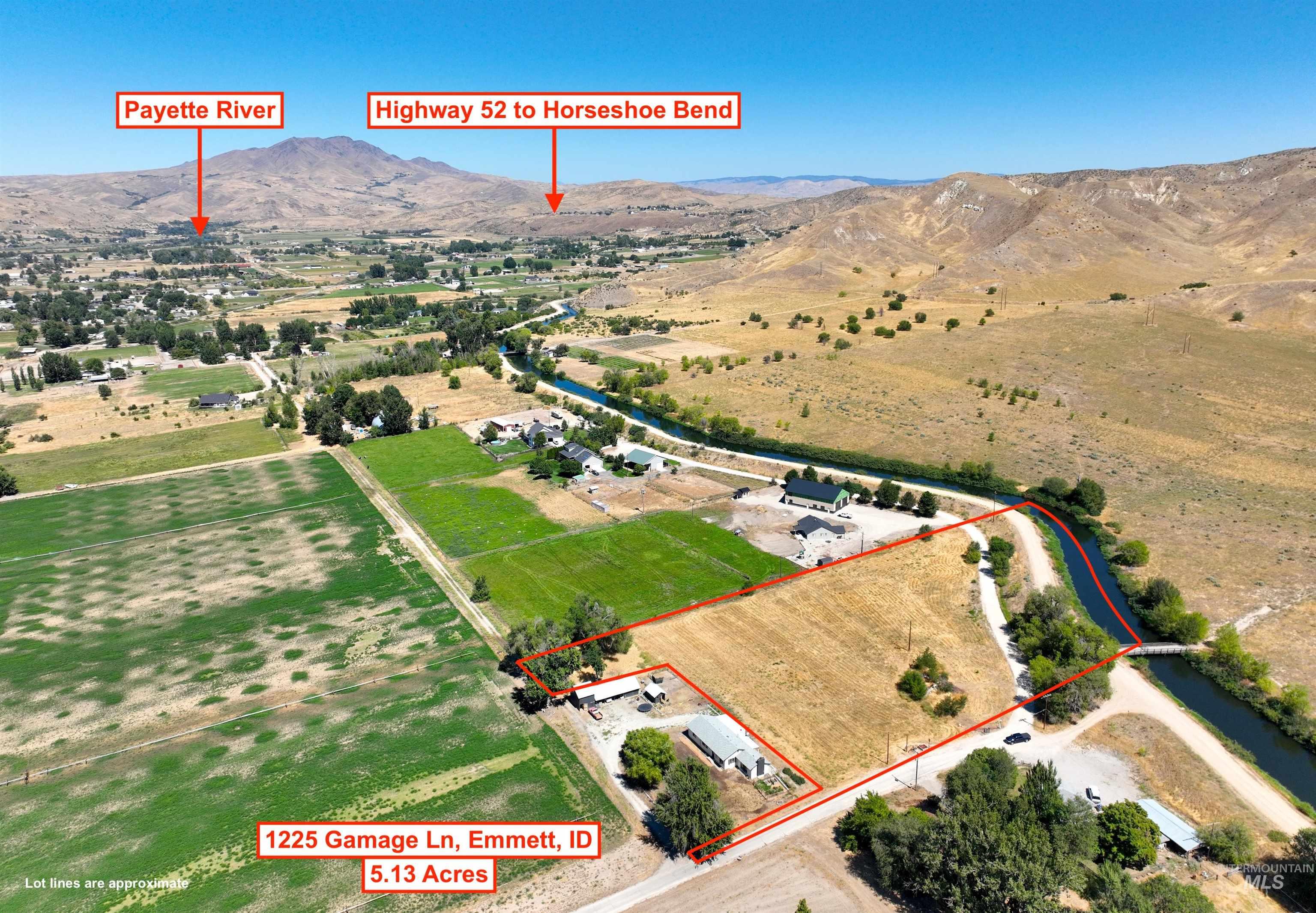 Overview of rural landscape with mountains and property parcel outlined