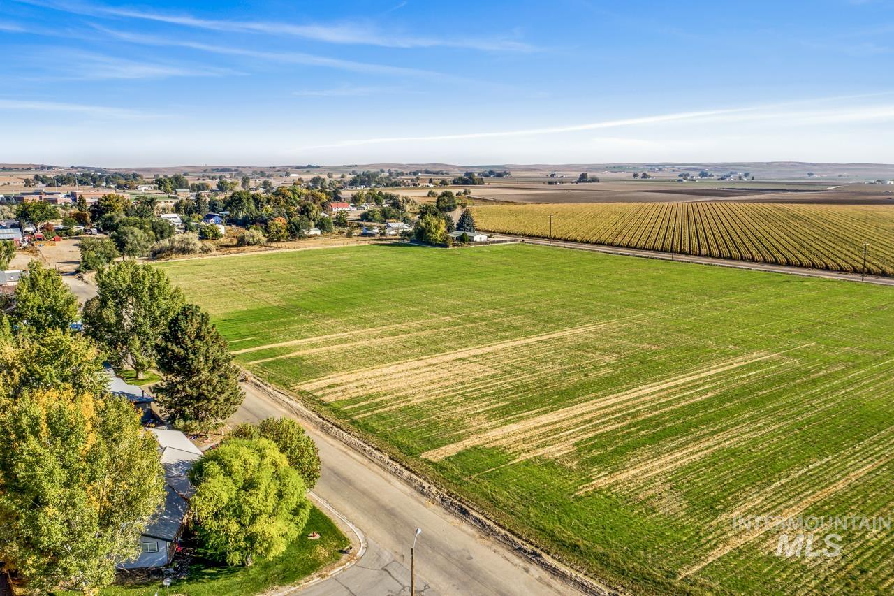 Overview of rural landscape featuring large plots for crops