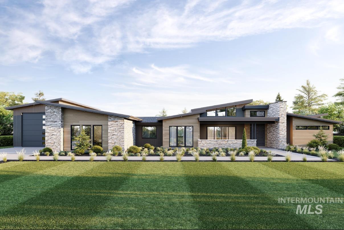 View of front of home with stone siding and a front yard