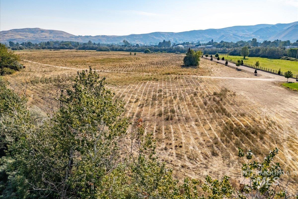 Aerial view of sparsely populated area with a mountainous background
