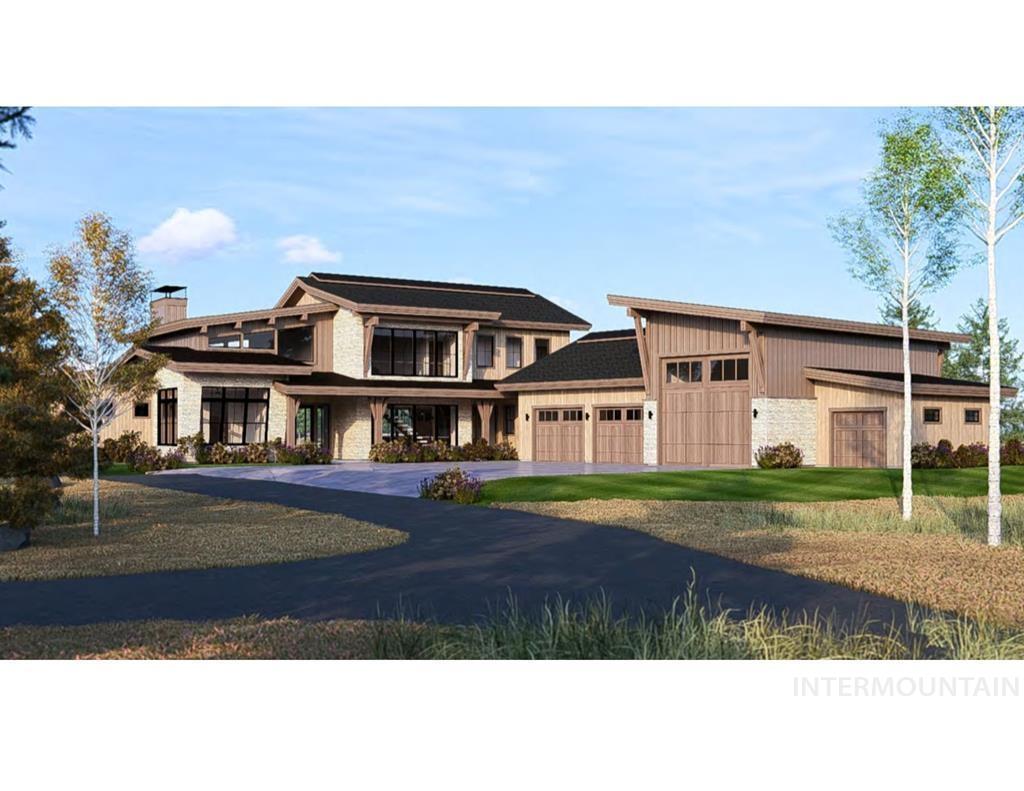 View of front of home featuring a chimney, a front lawn, driveway, an attached garage, and stone siding