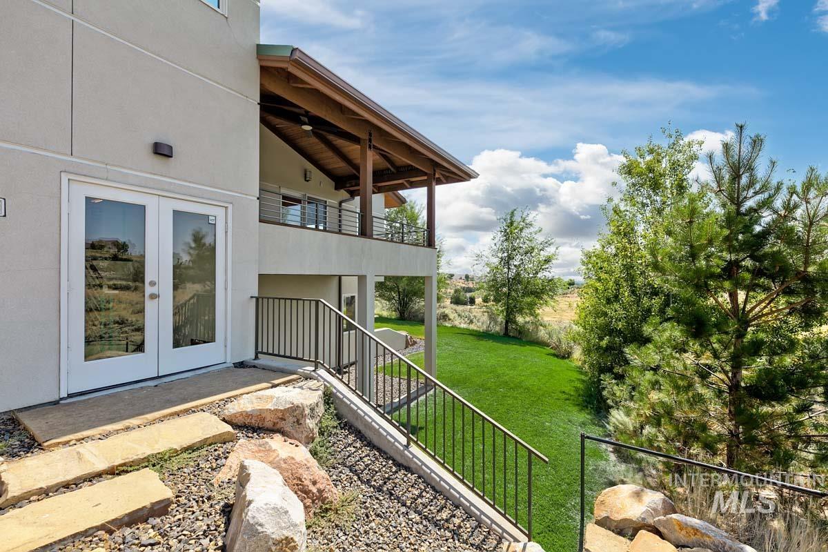 Doorway to property featuring french doors and stucco siding
