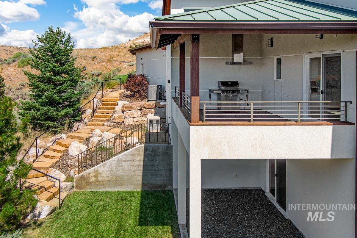 Patio / terrace featuring stairway, a patio area, and area for grilling