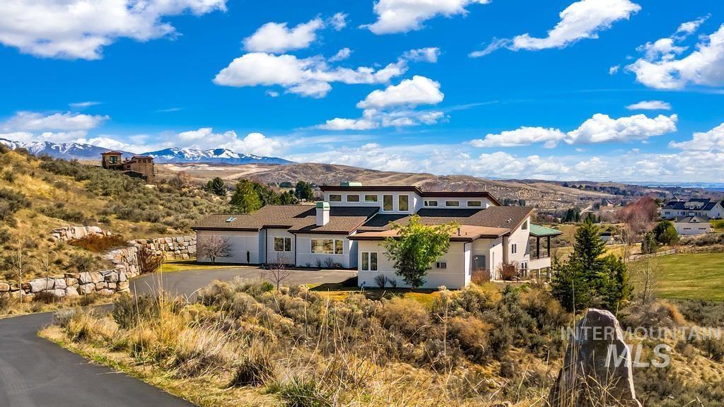 Prairie-style house featuring a mountain view