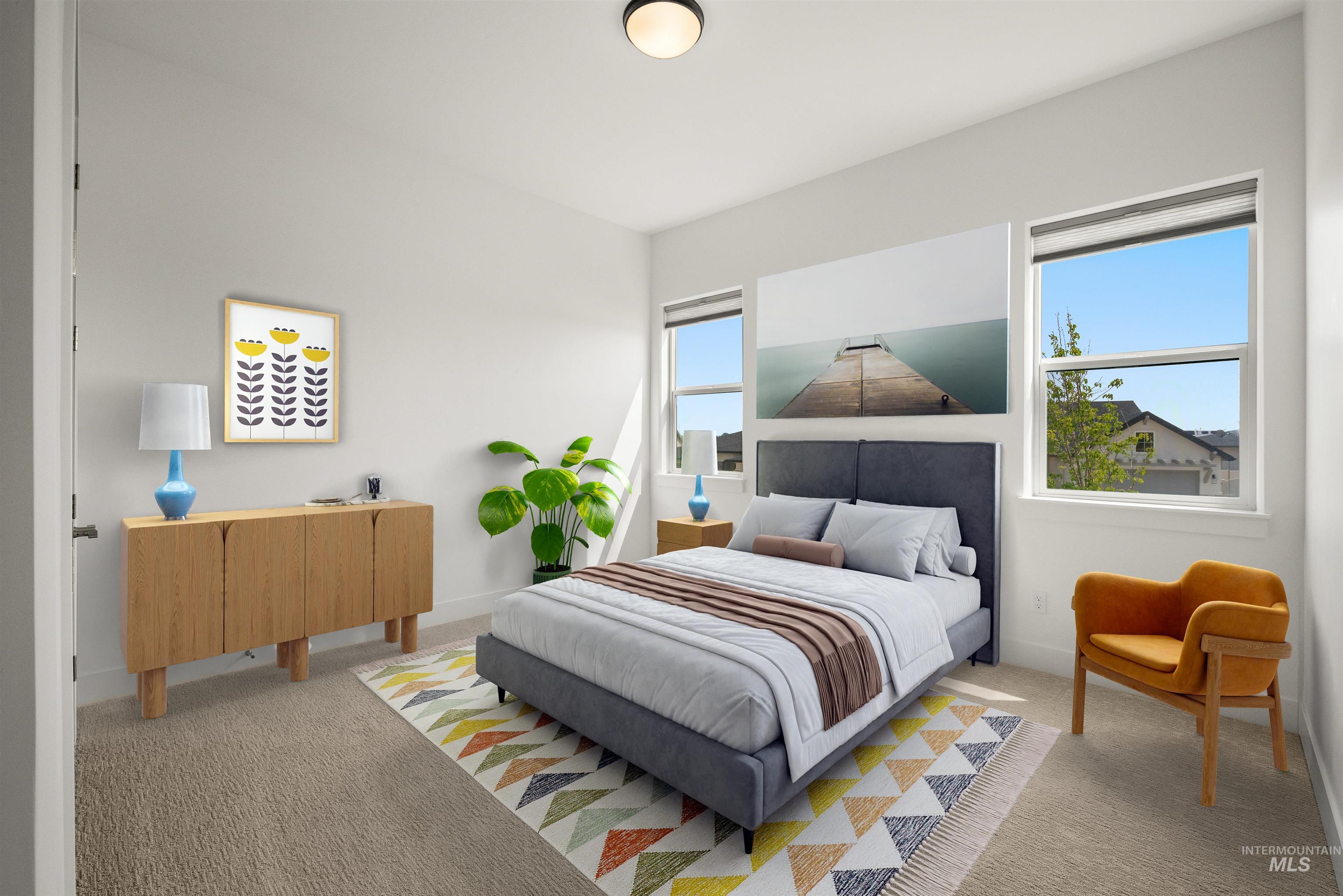 Bedroom featuring carpet flooring and baseboards