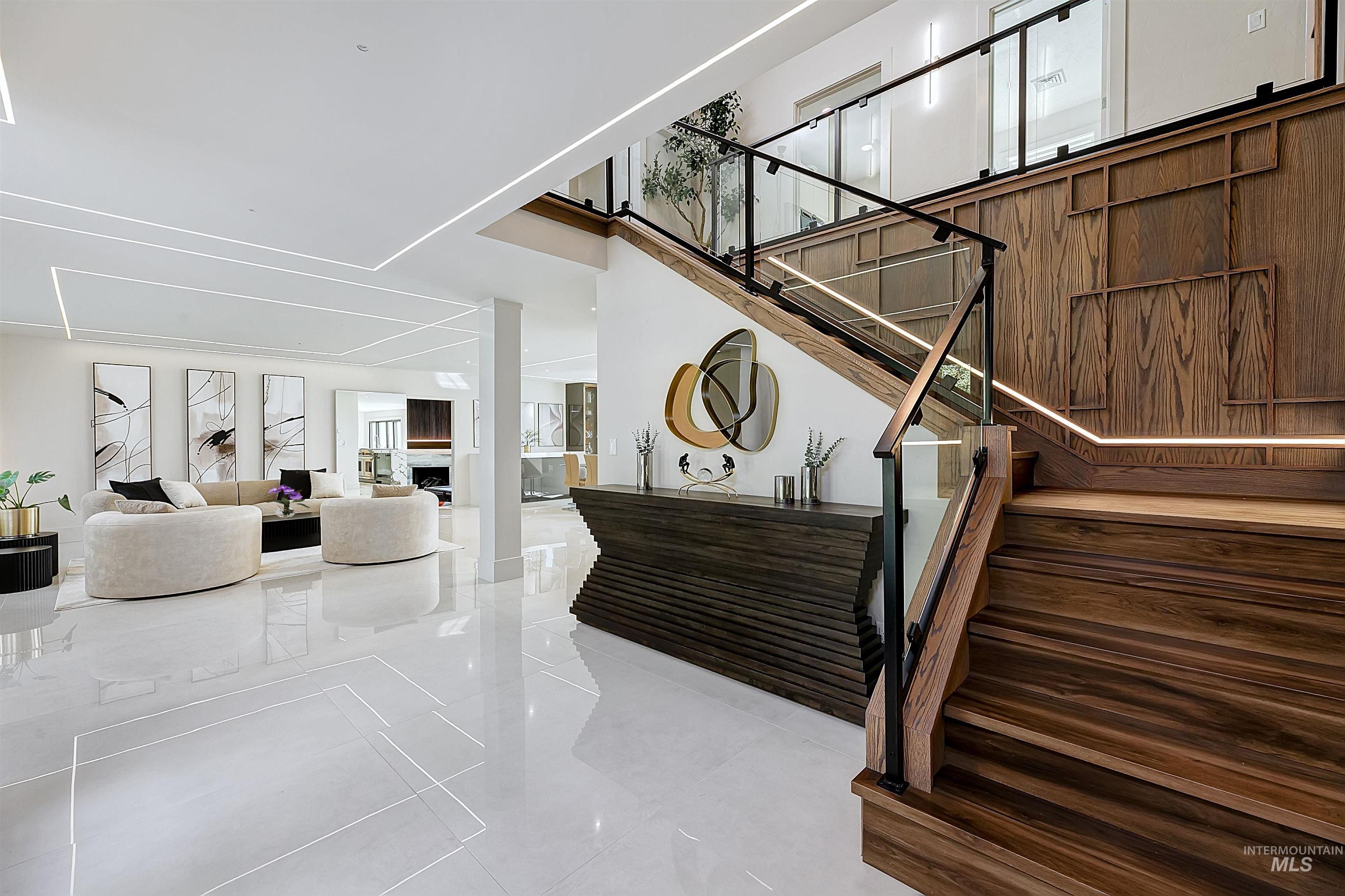 Stairs featuring tile patterned floors and stairs to upper level.