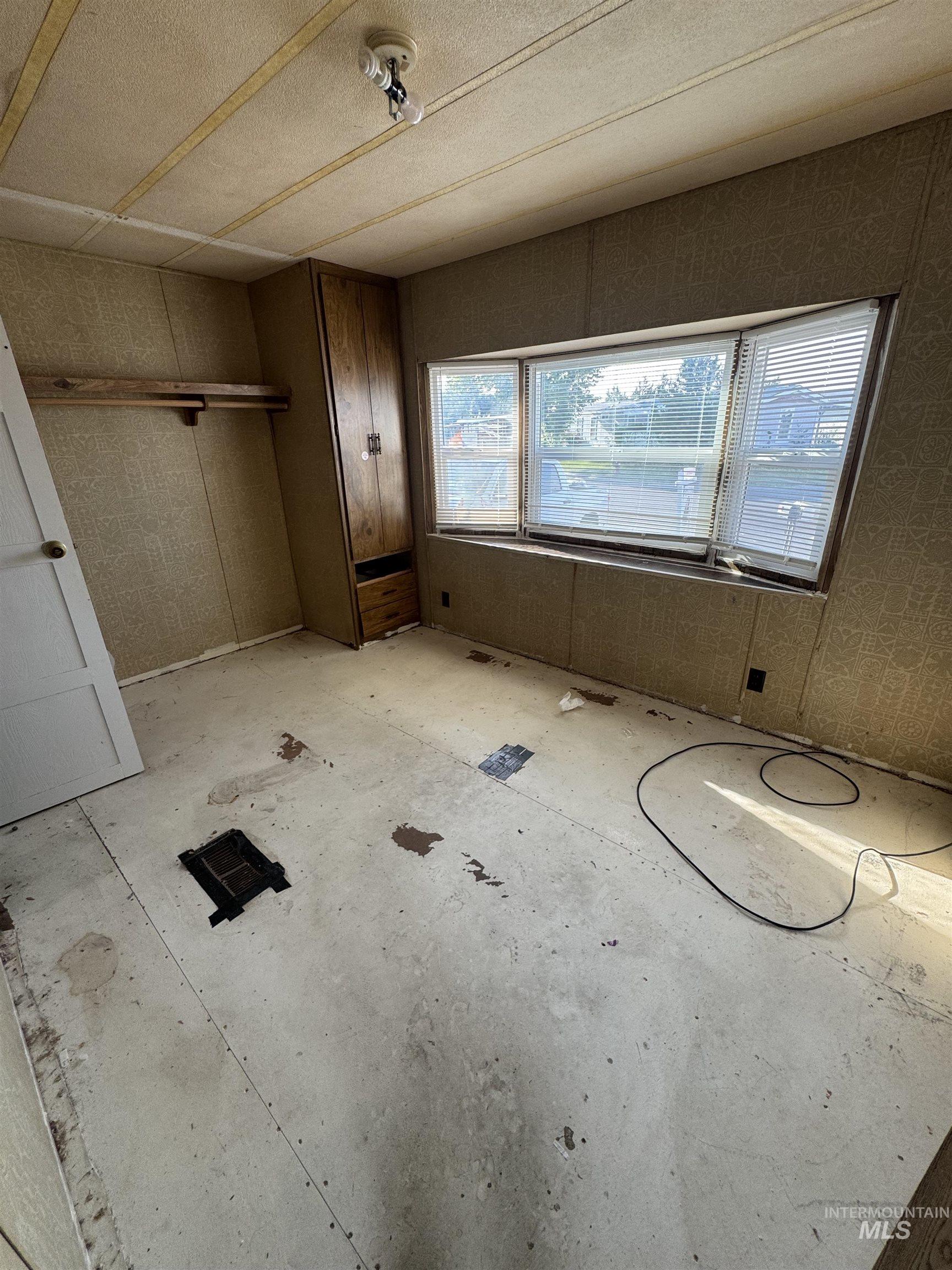 Unfurnished bedroom with a closet