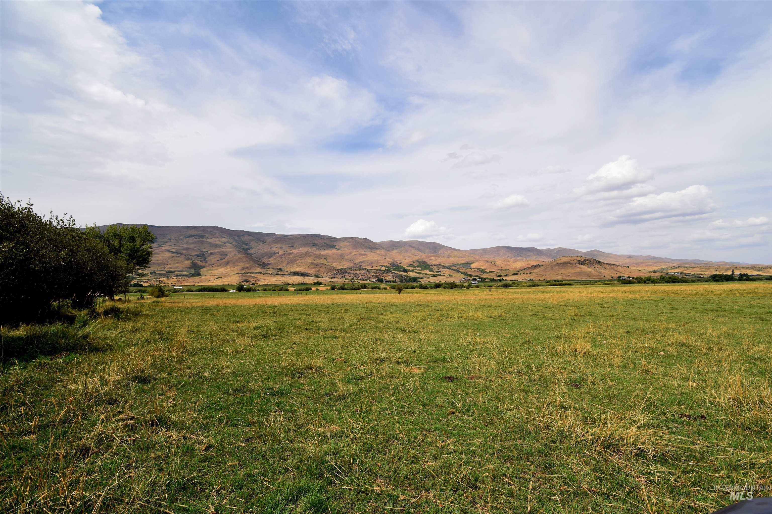 View of mountain background featuring rural landscape