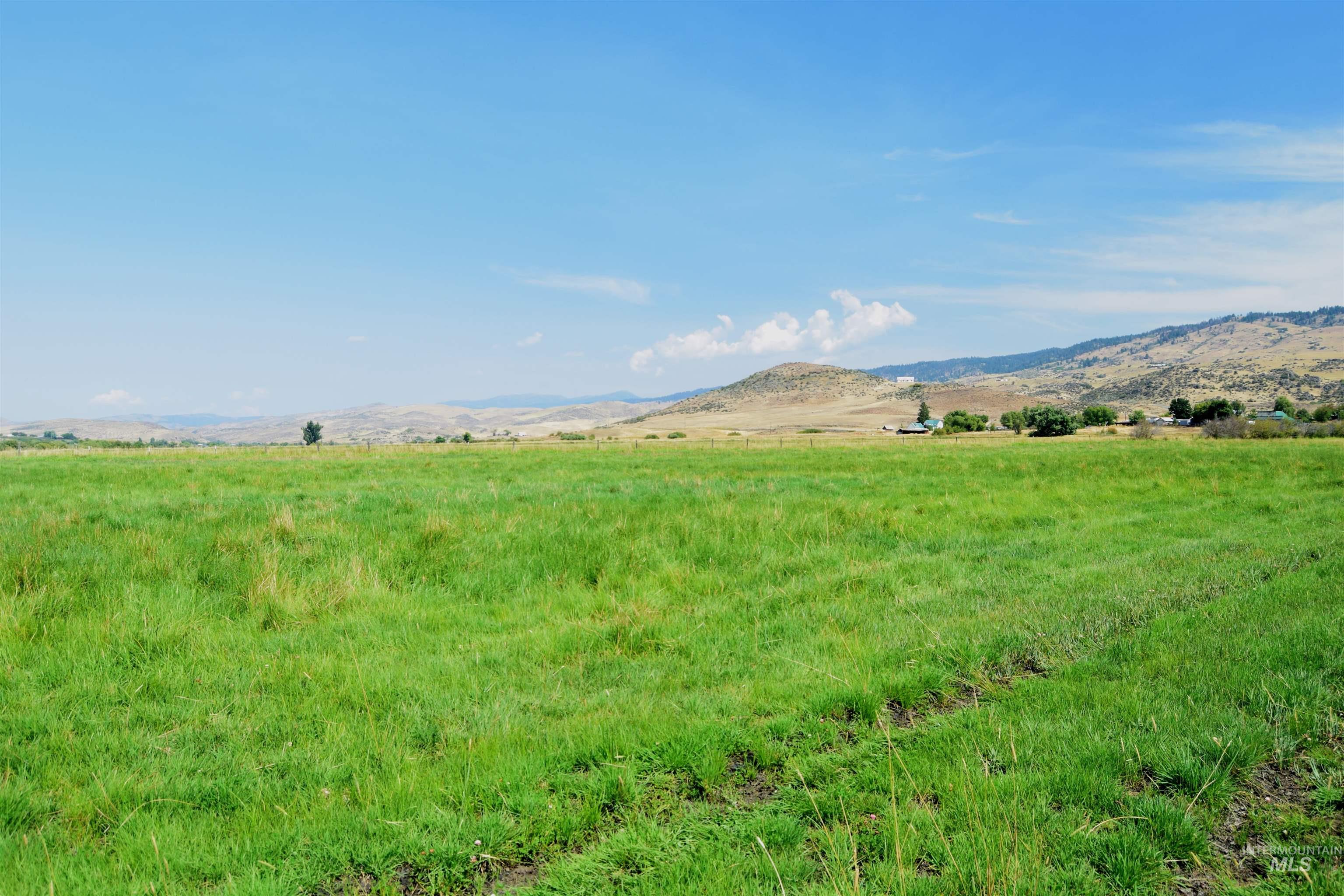 View of mountain background featuring rural landscape