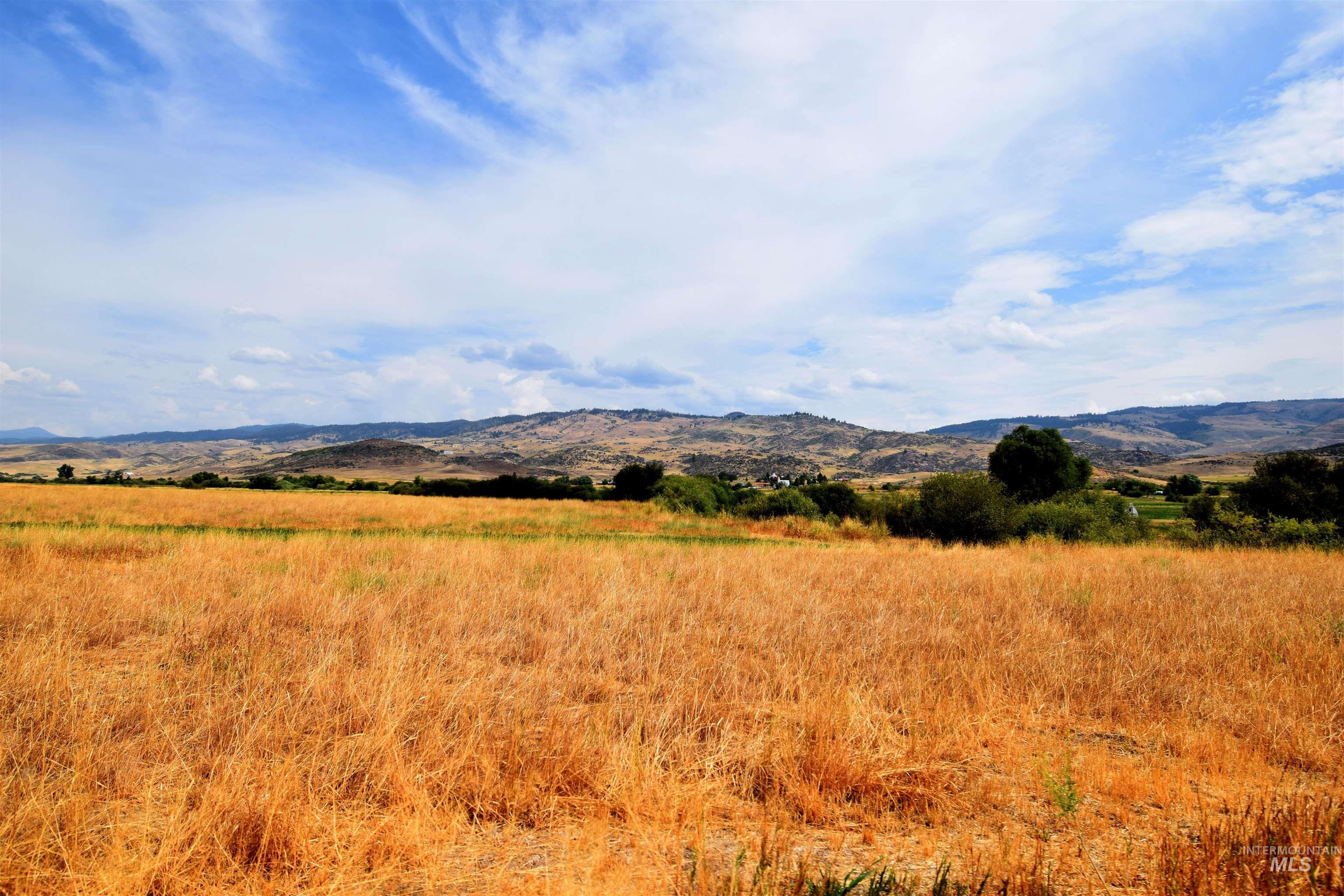 View of mountain backdrop featuring rural landscape