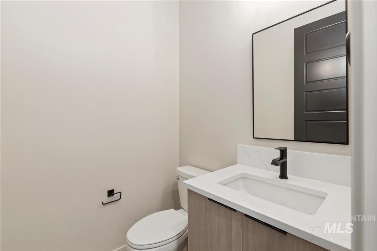 Bathroom featuring vanity and toilet