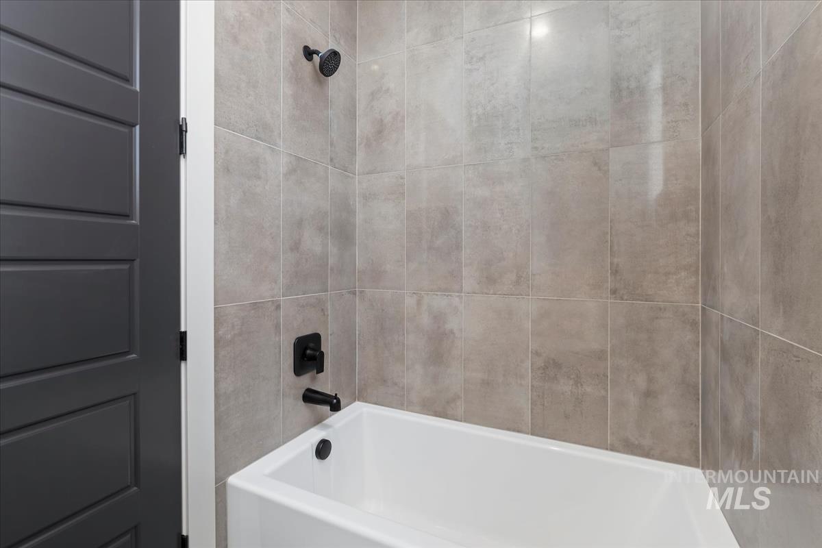 Bathroom featuring bathing tub / shower combination