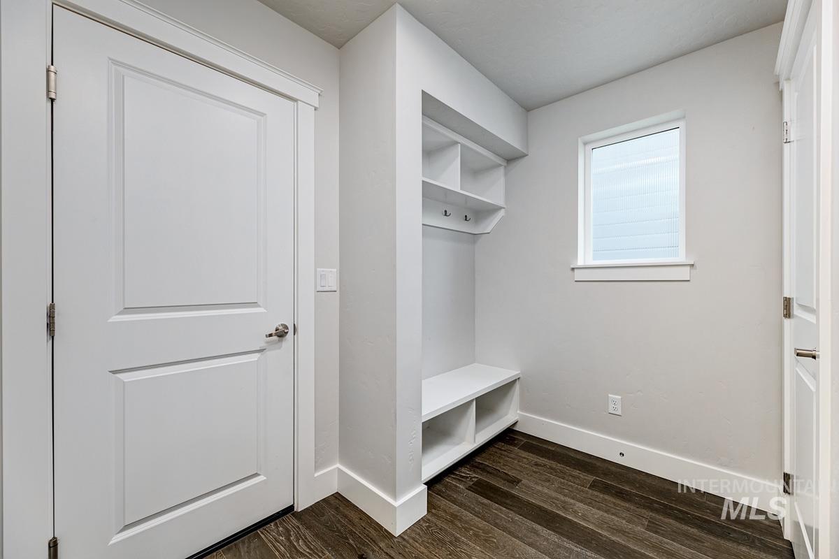 Mudroom with baseboards and dark wood-style flooring
