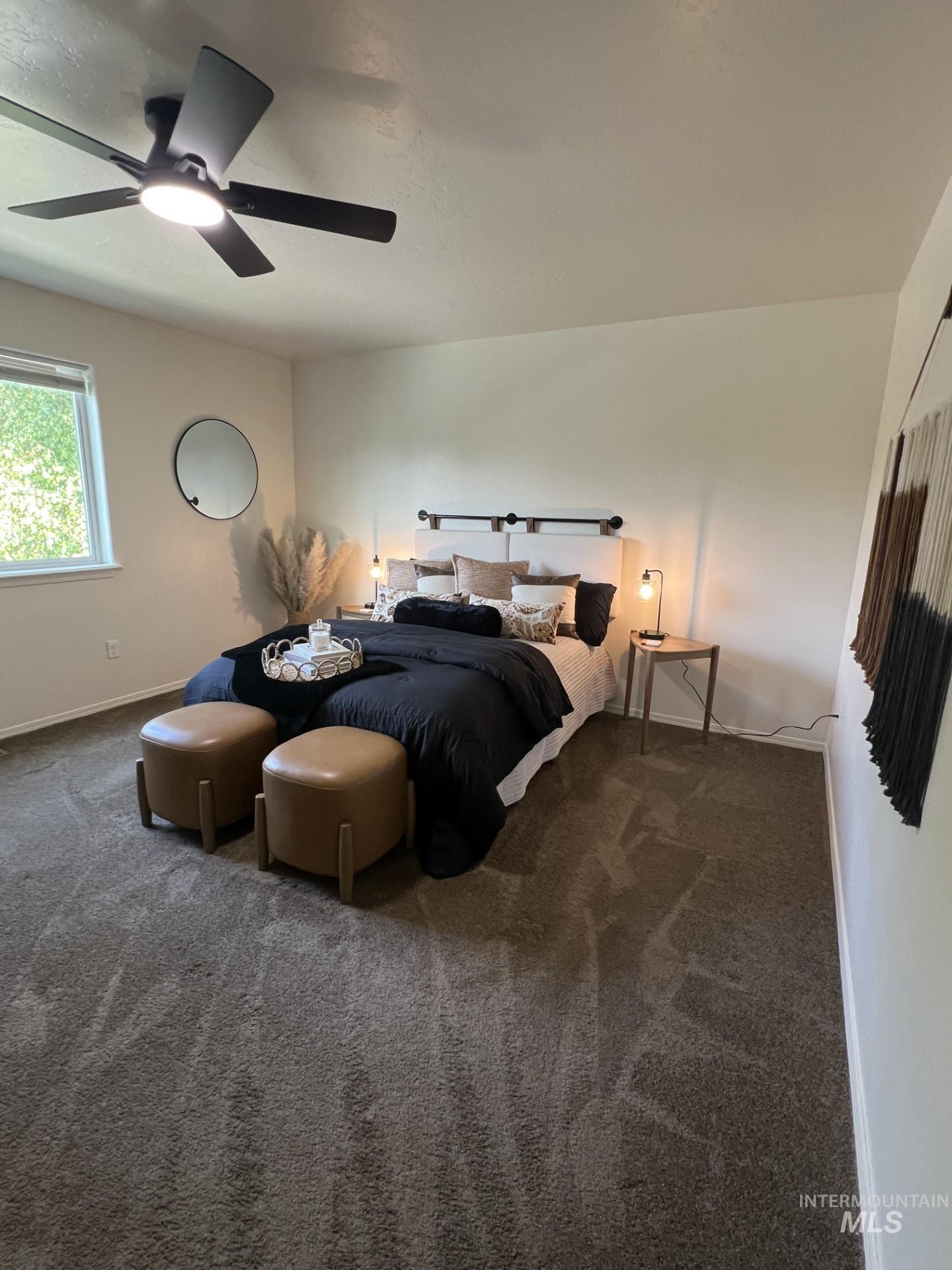 Bedroom featuring carpet flooring and ceiling fan