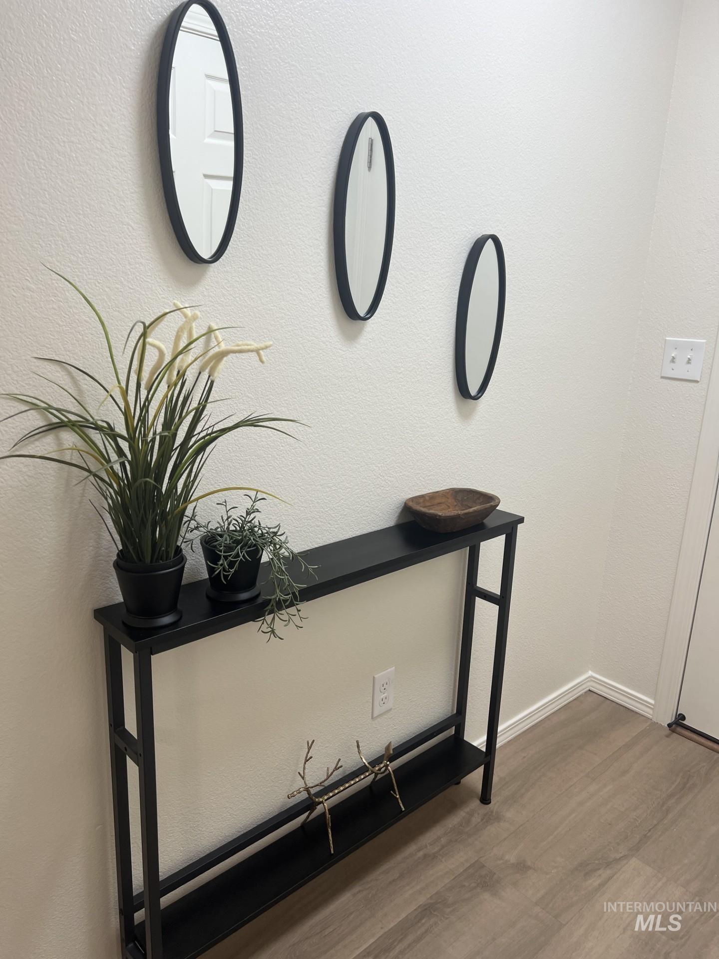 Detailed view of a textured wall and wood finished floors