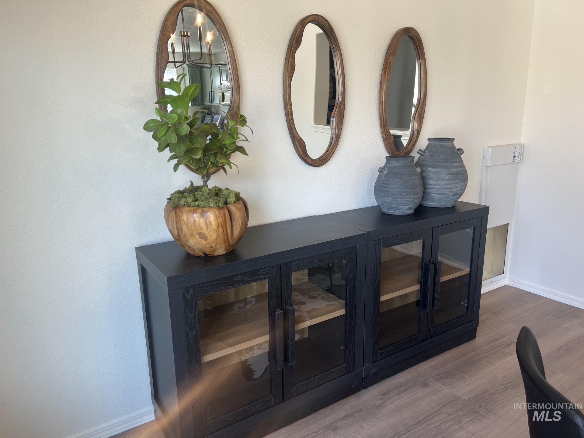 Detailed view of baseboards and wood finished floors