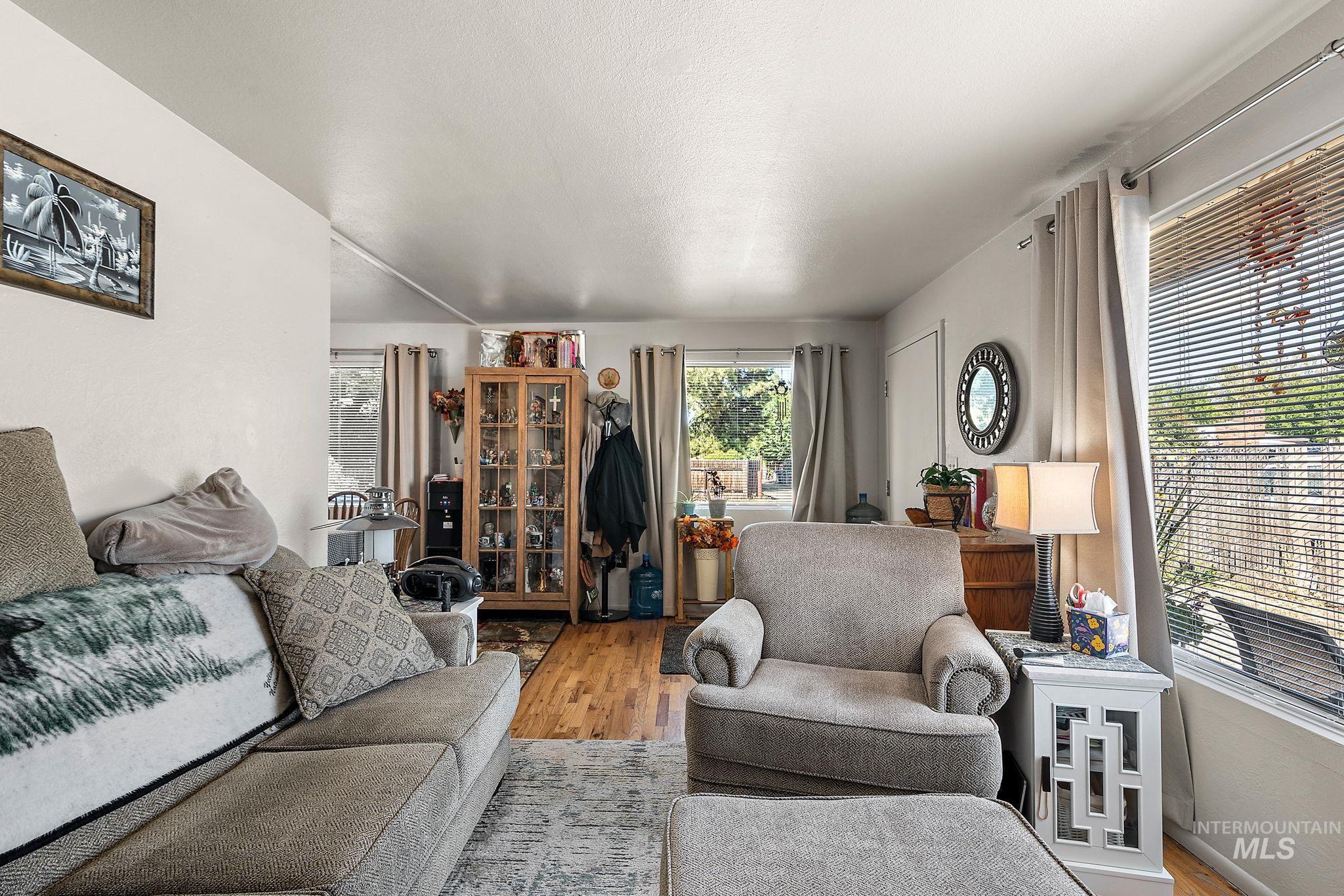 Living area featuring wood finished floors and healthy amount of natural light