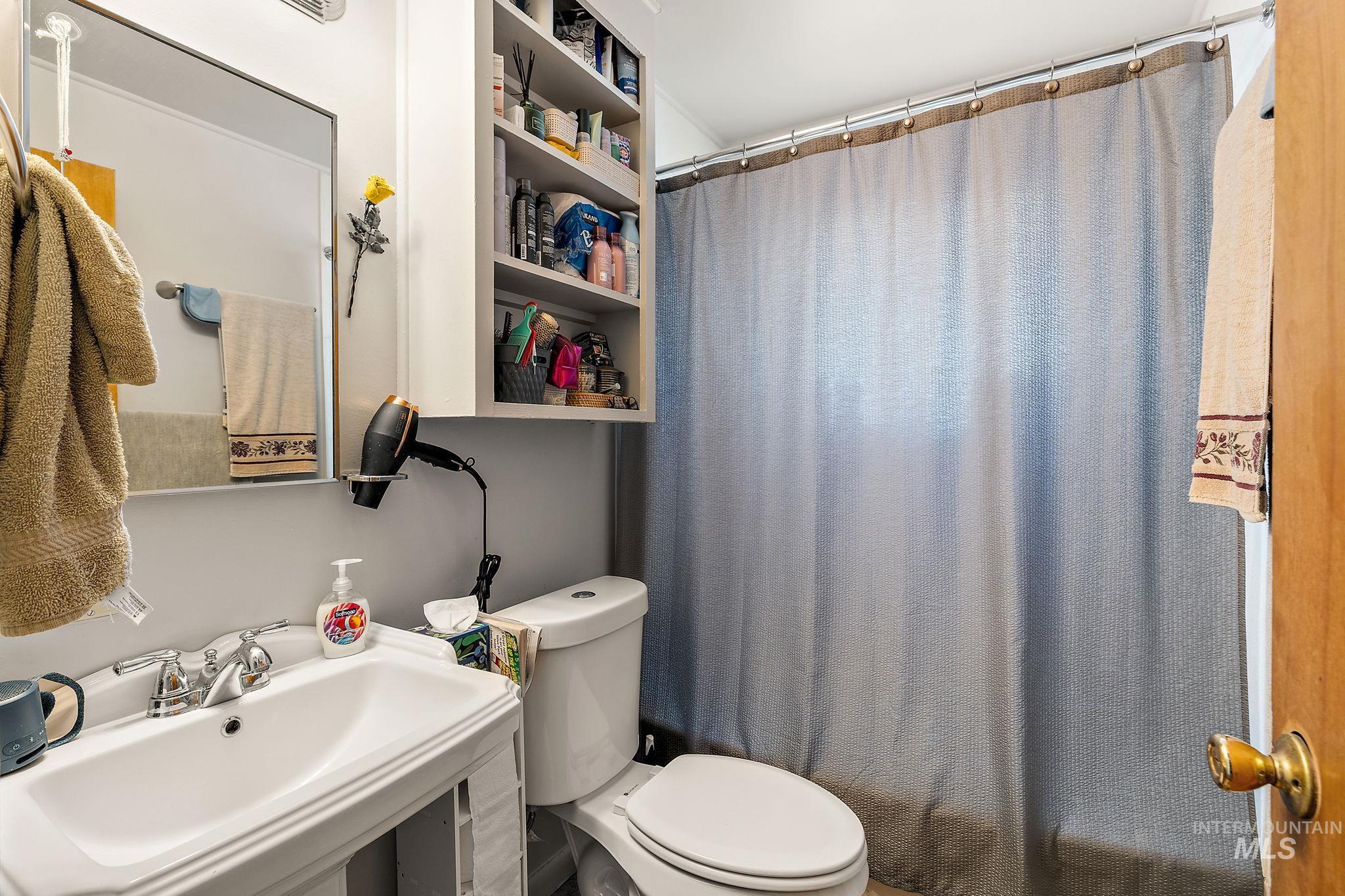 Bathroom featuring toilet and a sink