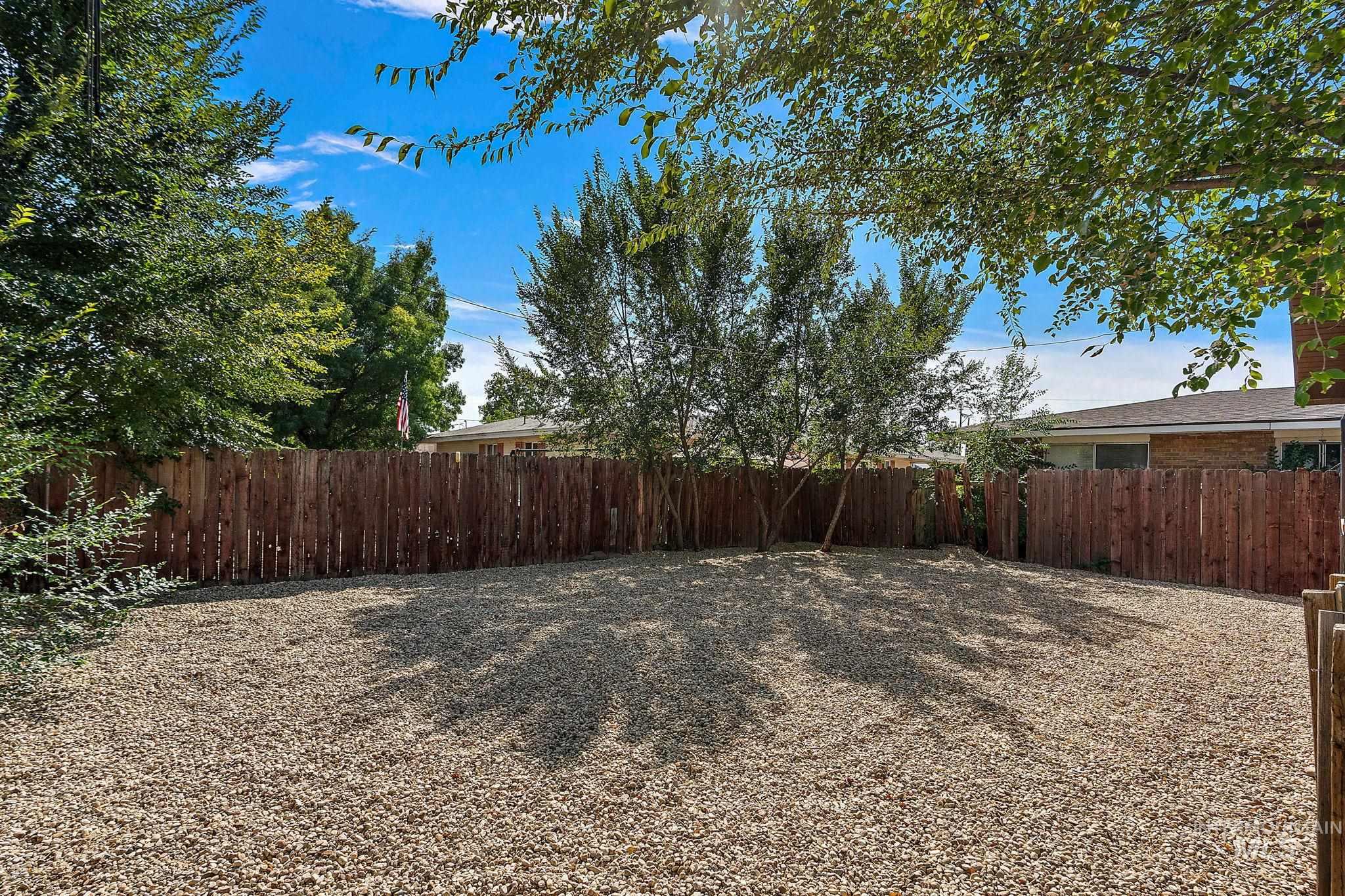 View of fenced backyard