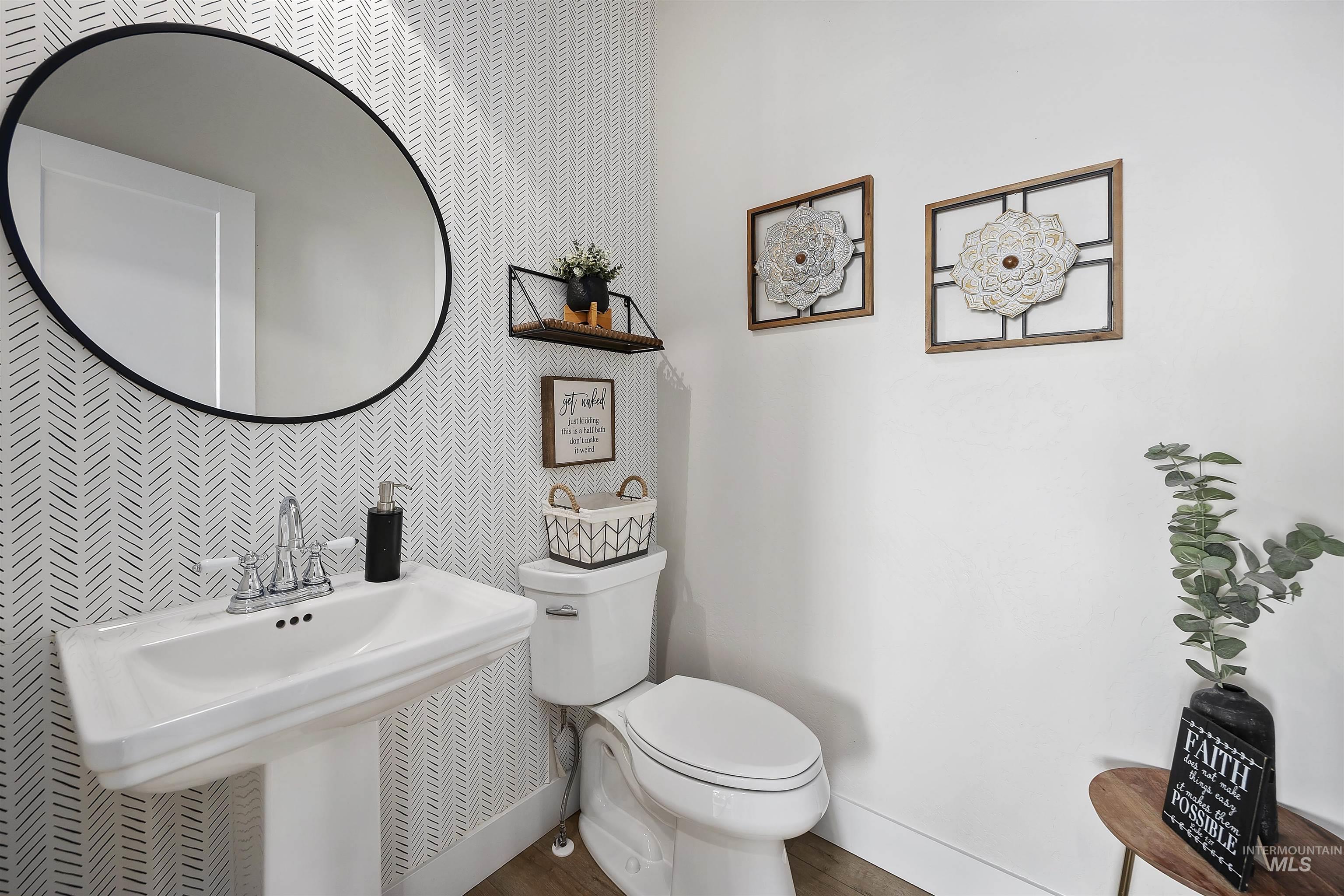 Bathroom featuring baseboards and toilet