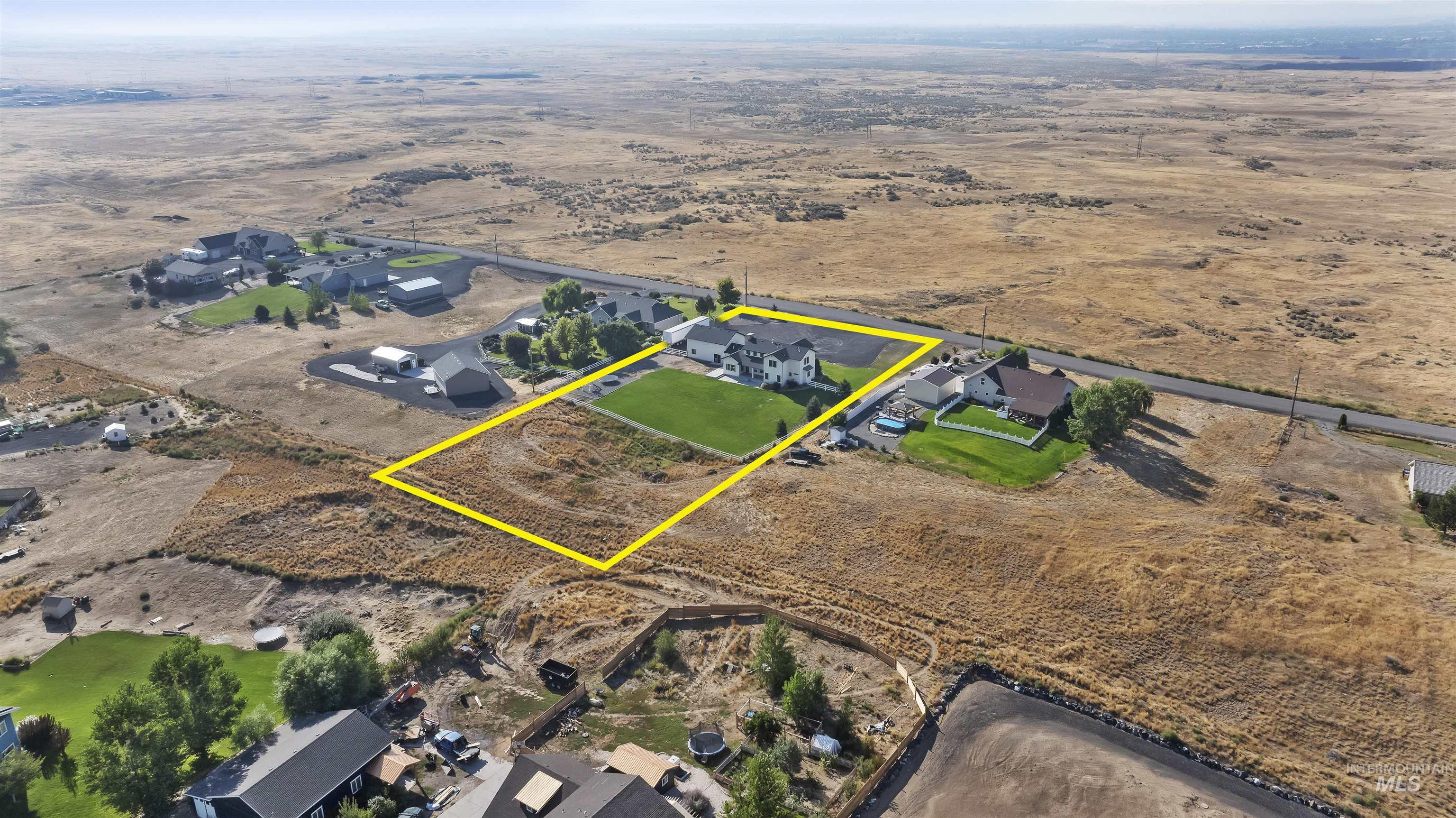 Aerial perspective of suburban area featuring property boundaries highlighted
