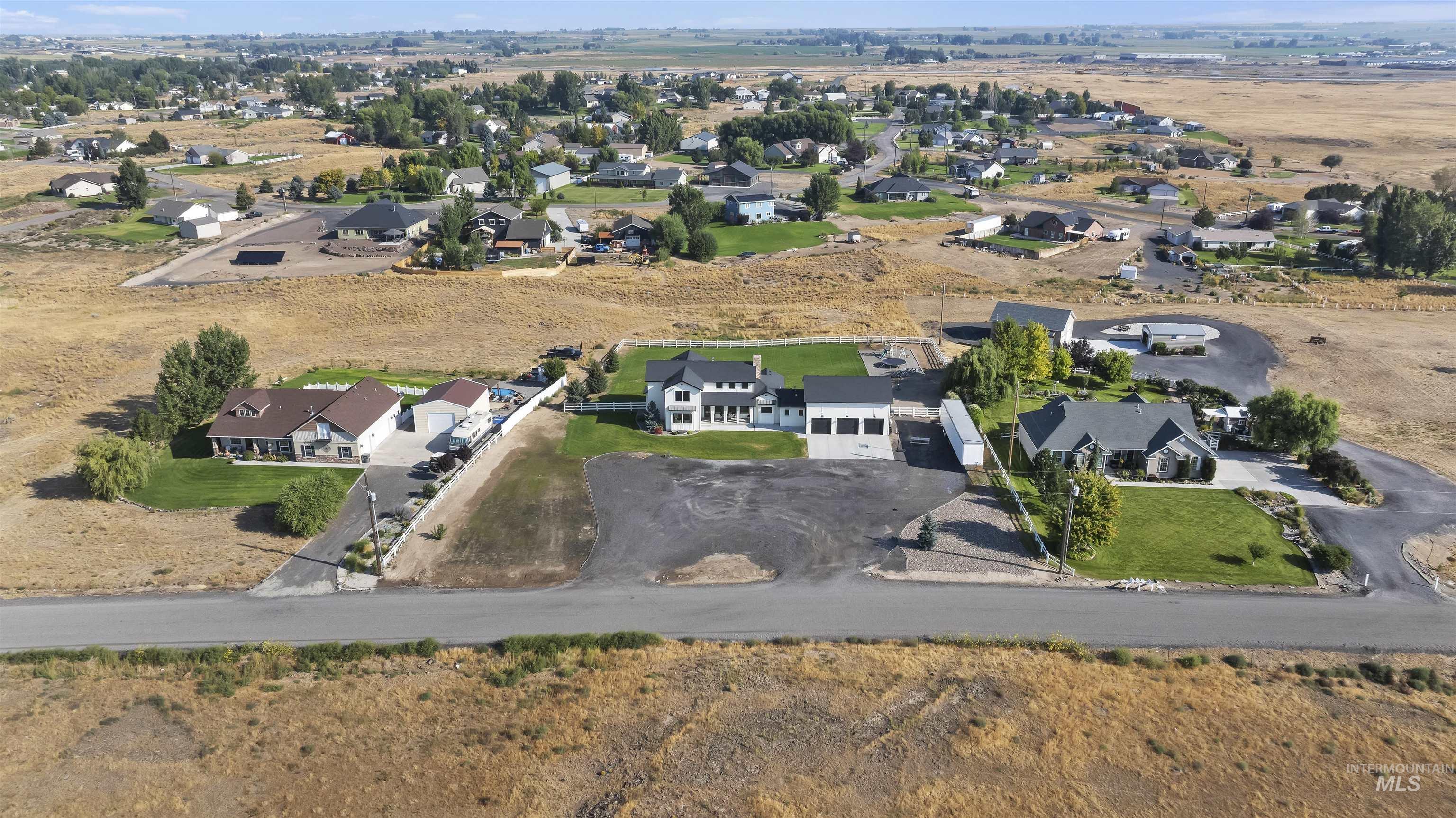 Aerial overview of property's location with nearby suburban area