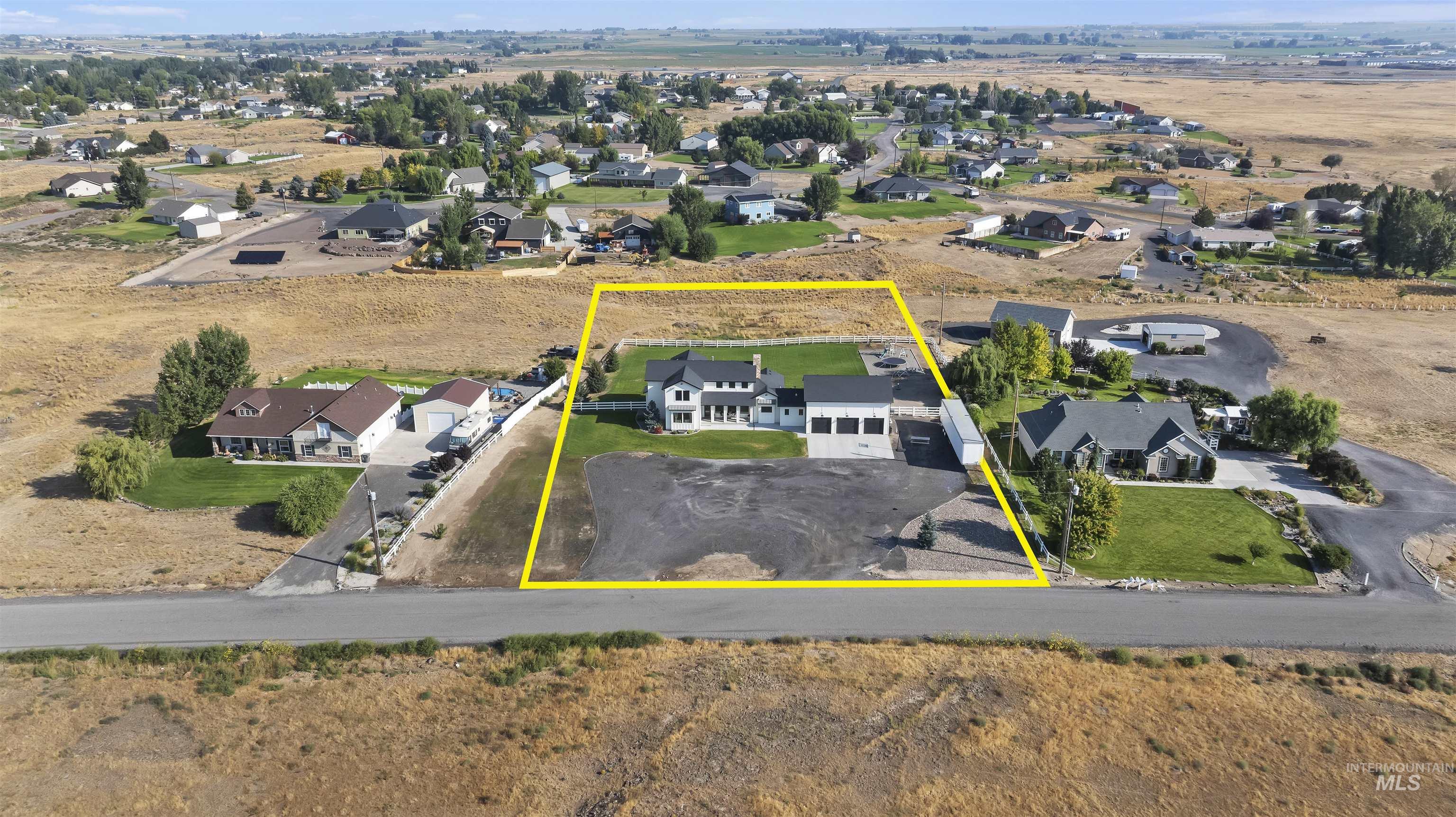 Aerial perspective of suburban area with property parcel outlined