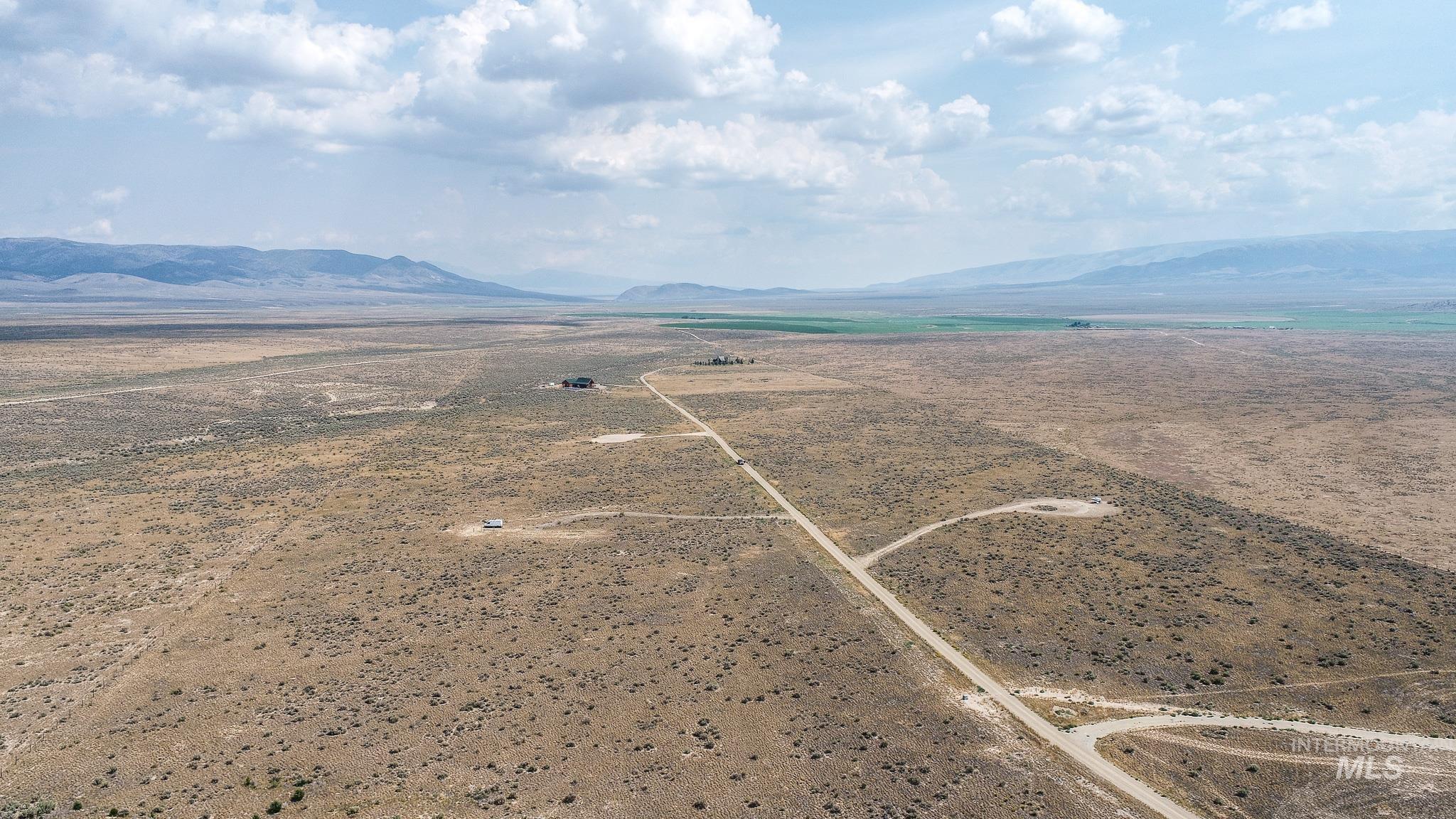 Aerial view of sparsely populated area featuring a mountain backdrop