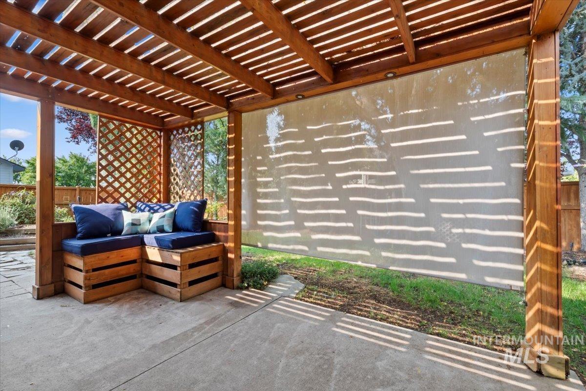View of patio featuring a pergola and outdoor lounge area