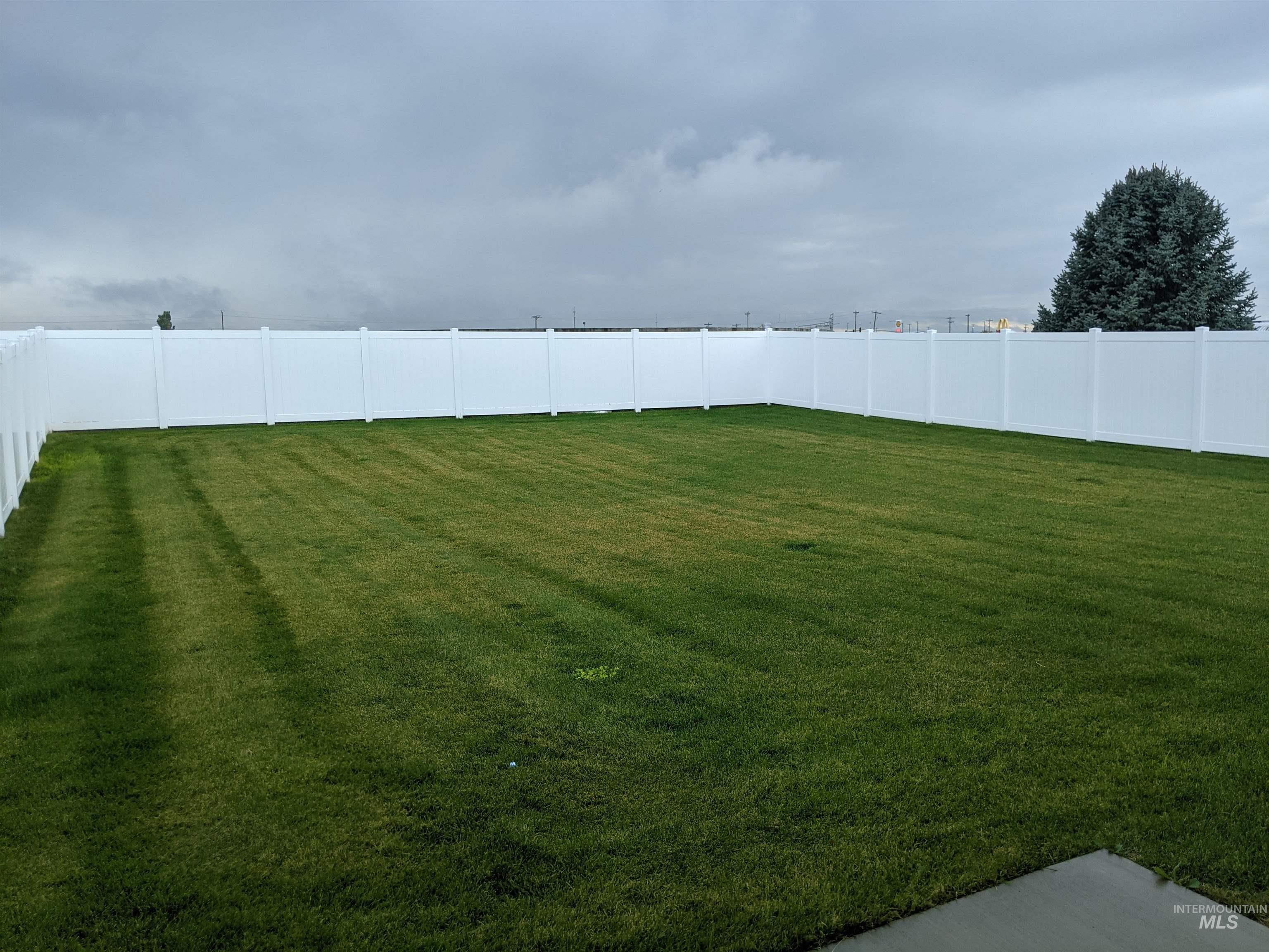 View of fenced backyard