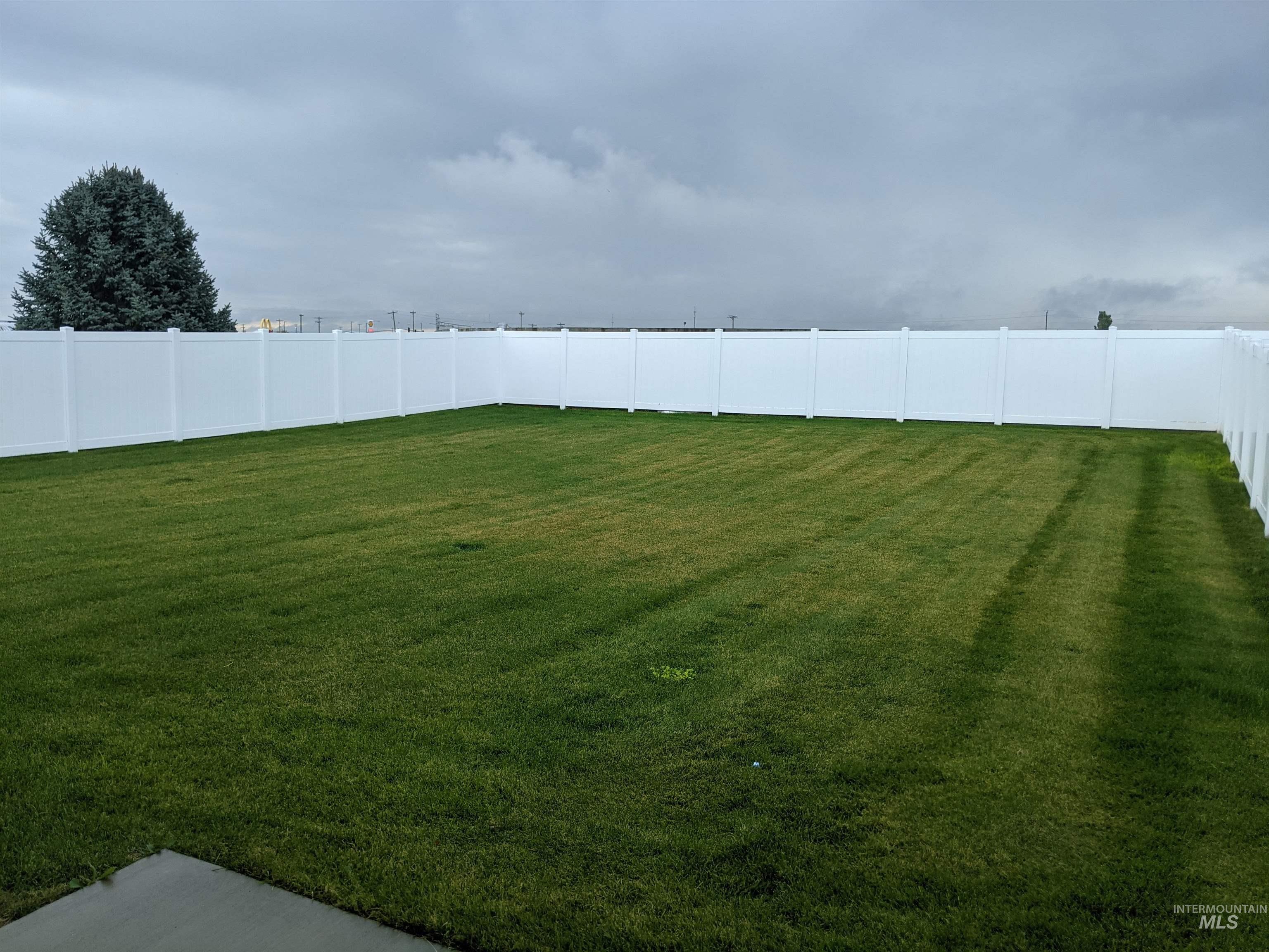 View of fenced backyard
