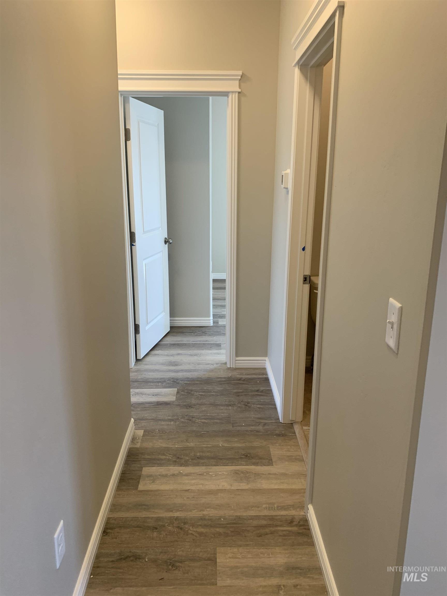 Hall featuring light wood finished floors