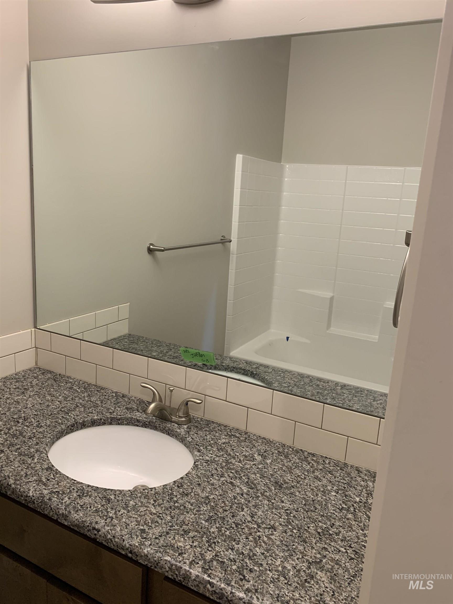Full bathroom with vanity and shower / washtub combination