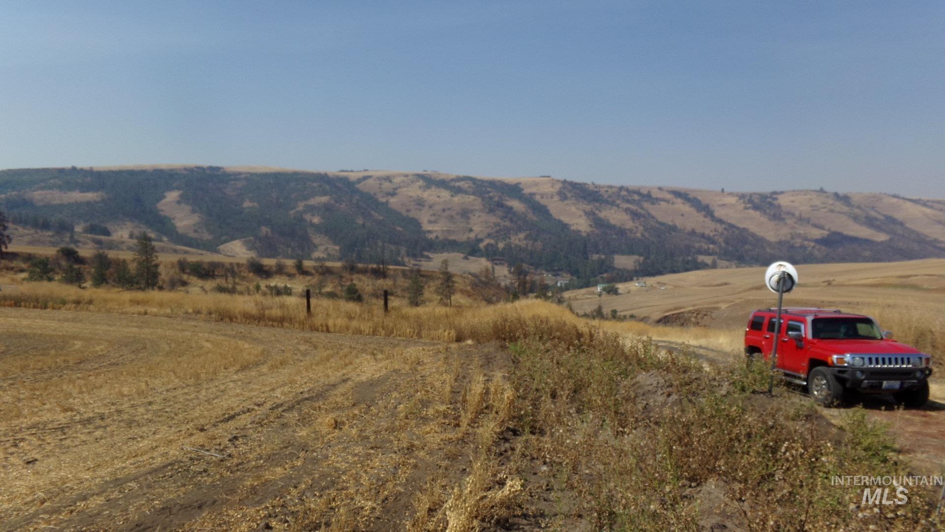 View of mountain background featuring rural landscape