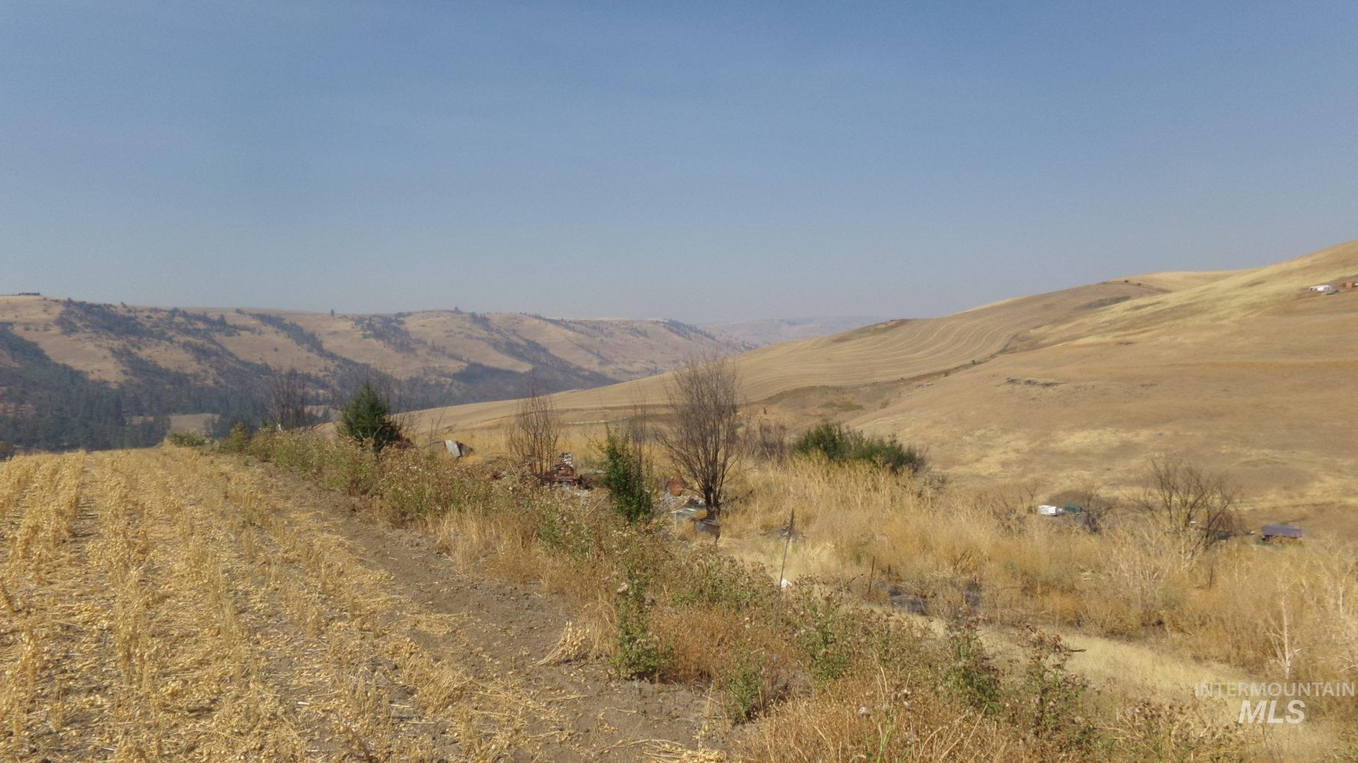 View of mountain backdrop featuring rural landscape