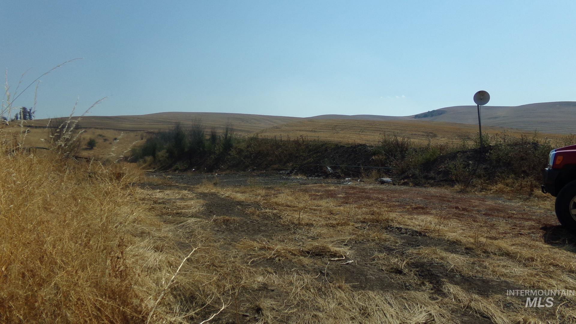View of mountain background featuring rural landscape