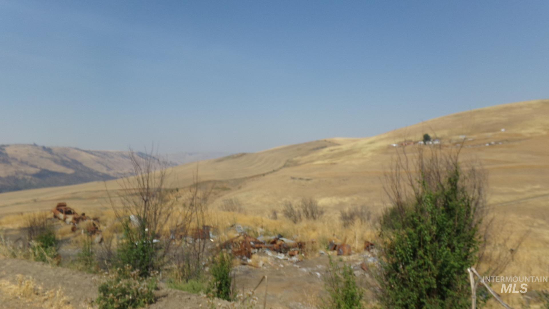 View of mountain backdrop with rural landscape