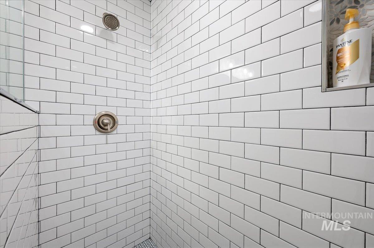 Full bathroom with a tile shower