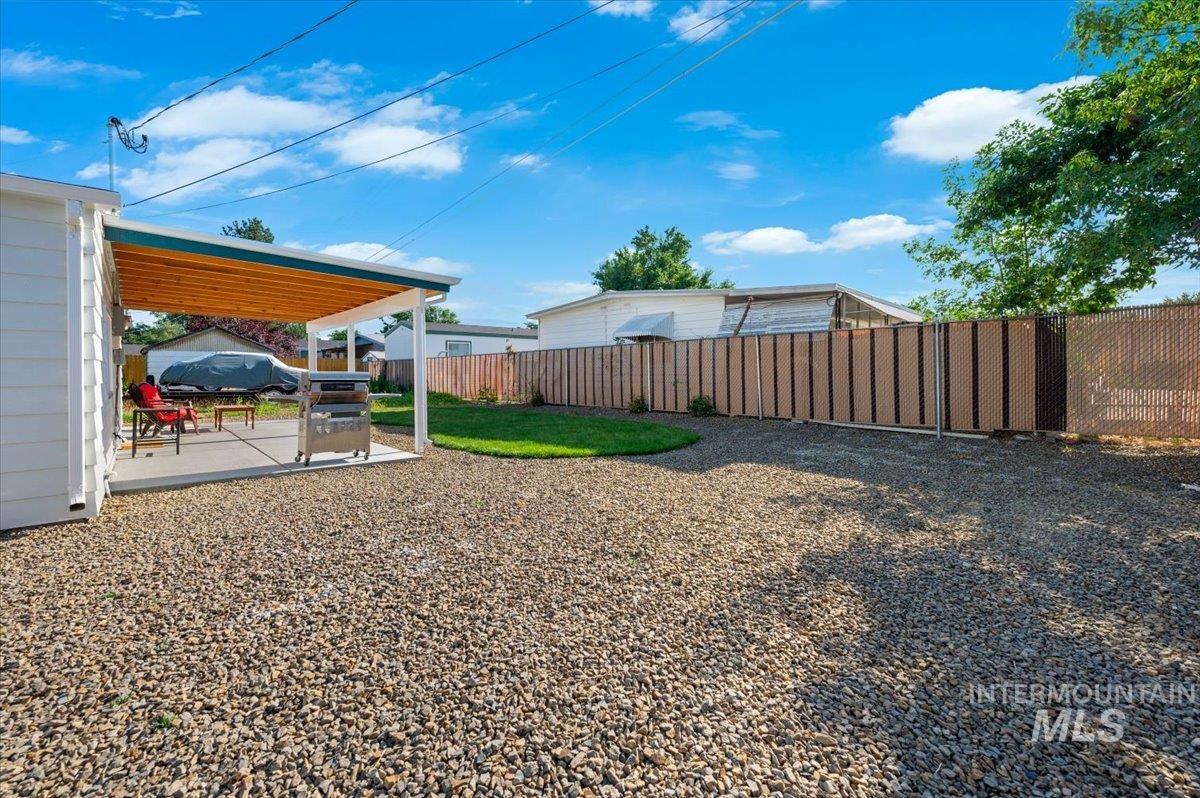Fenced backyard with a patio area