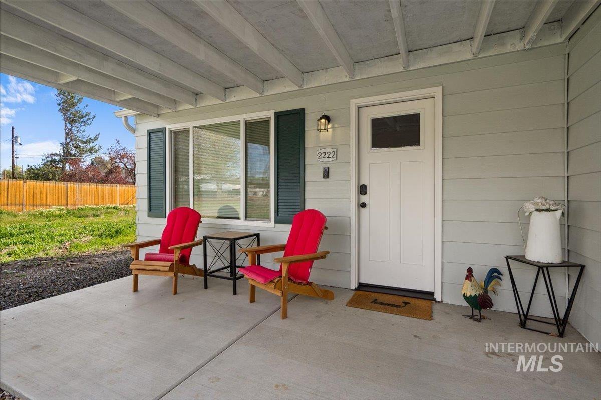 Property entrance with a patio area